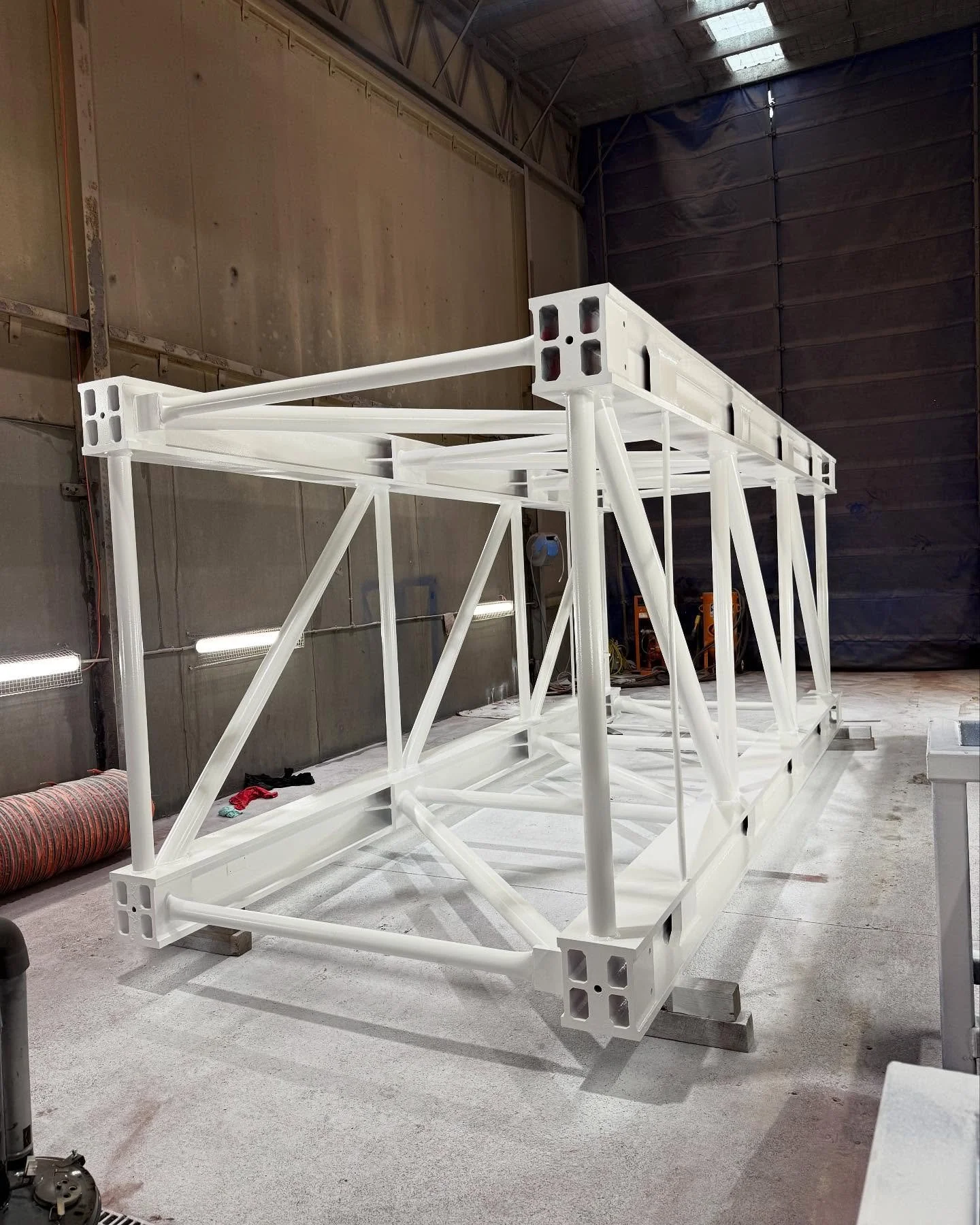 Complete colour change from red to white for this tower crane section! Blasted, painted &amp; on its way to South Australia. Easy work for the team at CGE 💪