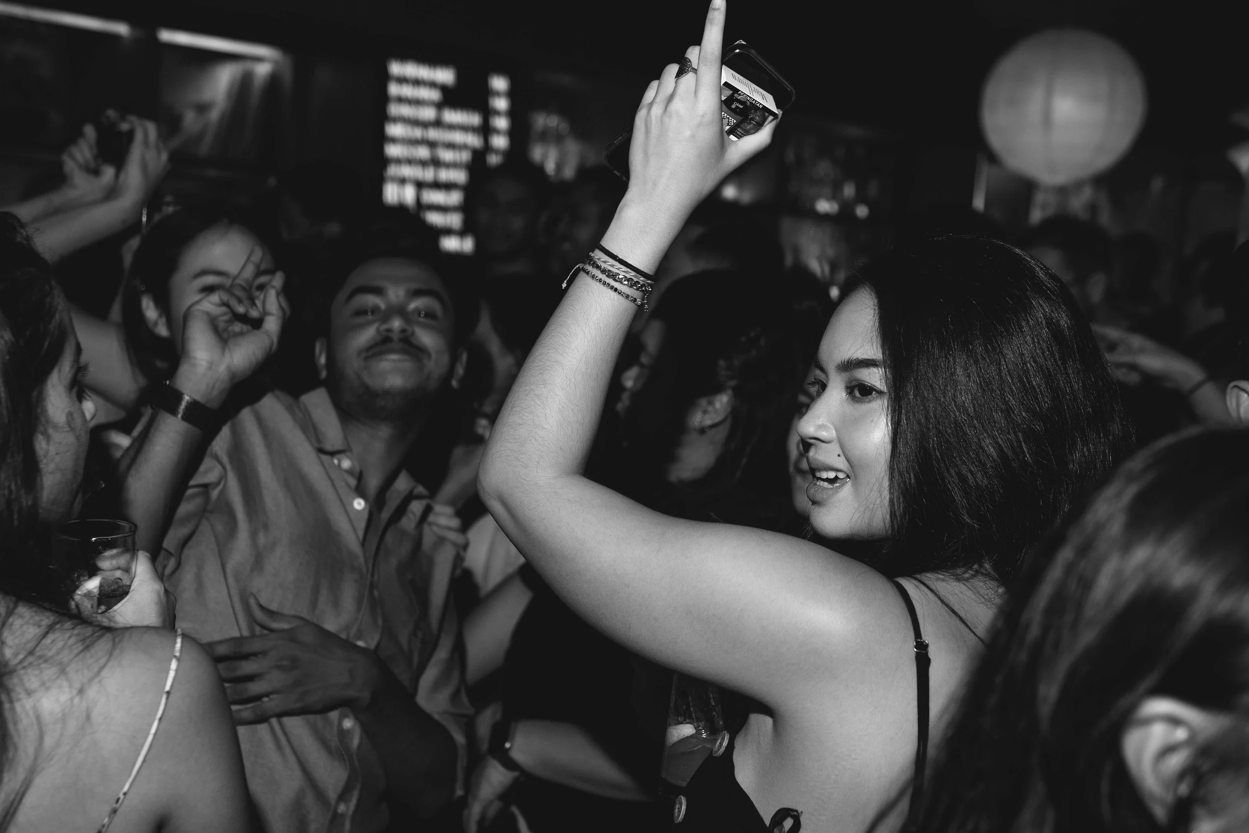 People dancing and socializing at a lively party or celebration.