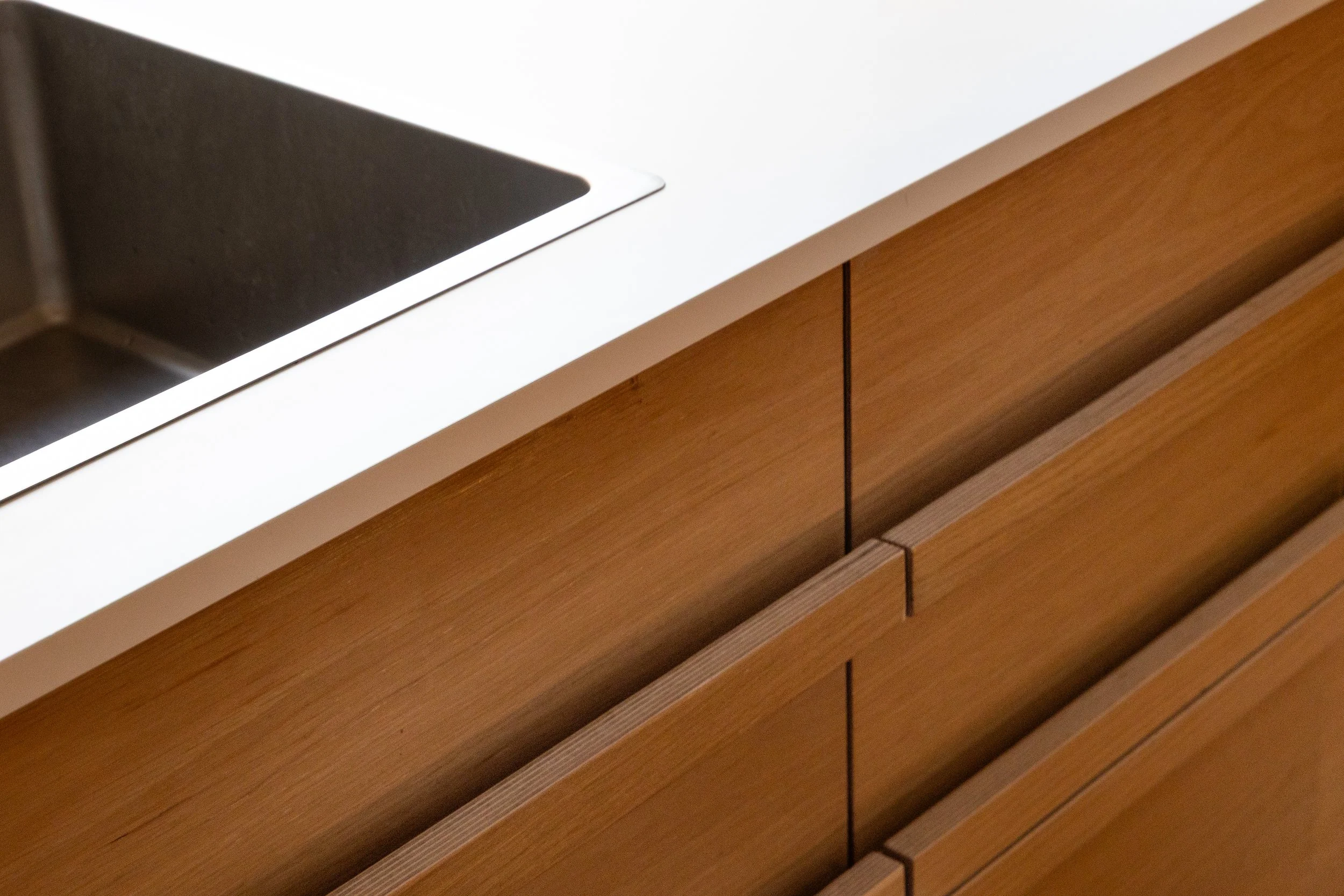 oak veneerd plywood, fenix countertop, solid oak side slats, custom made plywood handles