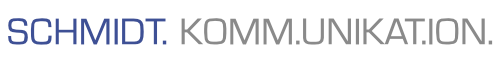 Schriftzug mit dem Text "SCHMIDT. KOMM.UNIKATION." auf schwarzem Hintergrund.