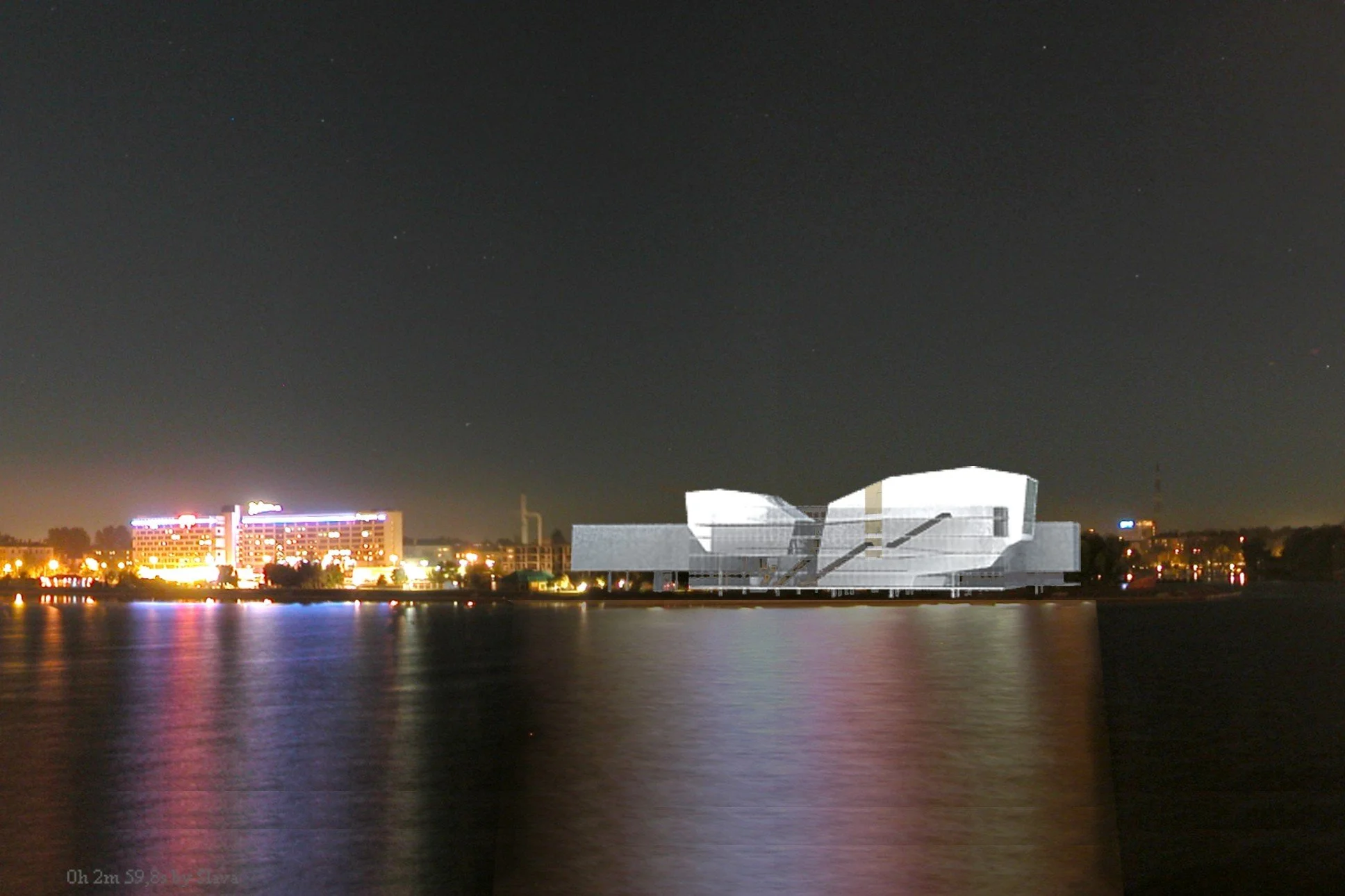 Nighttime cityscape with a large, modern building under construction along a body of water, reflecting city lights on the water's surface.