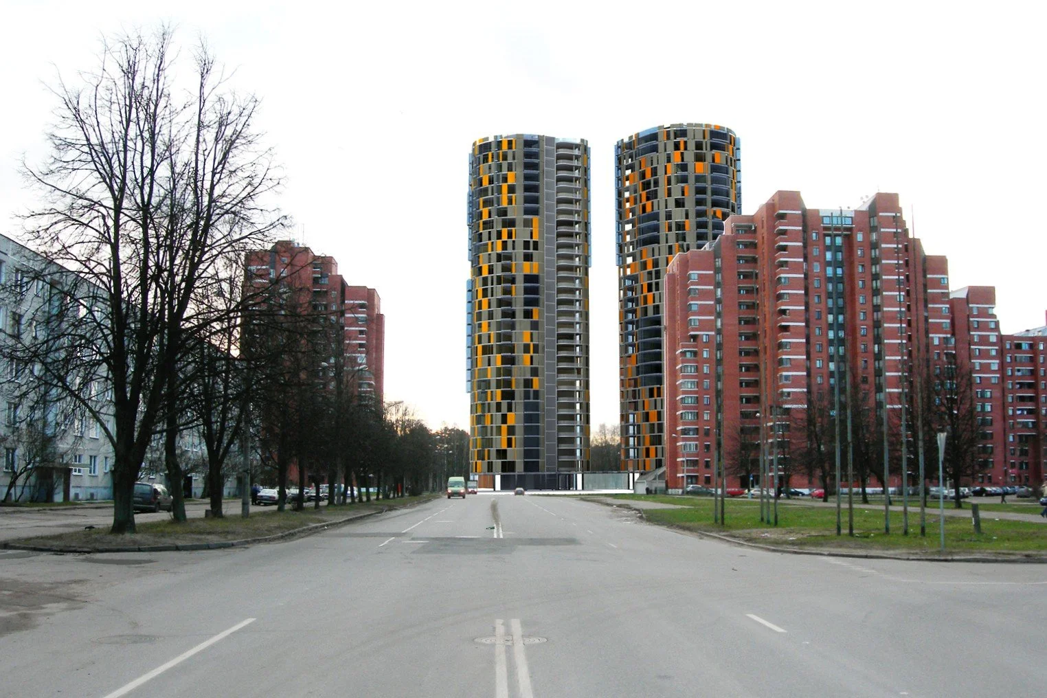 A city street with two modern high-rise buildings featuring a mix of orange, black, and gray panels, flanked by older red-brick apartment buildings on either side, with leafless trees and parked cars along the street.