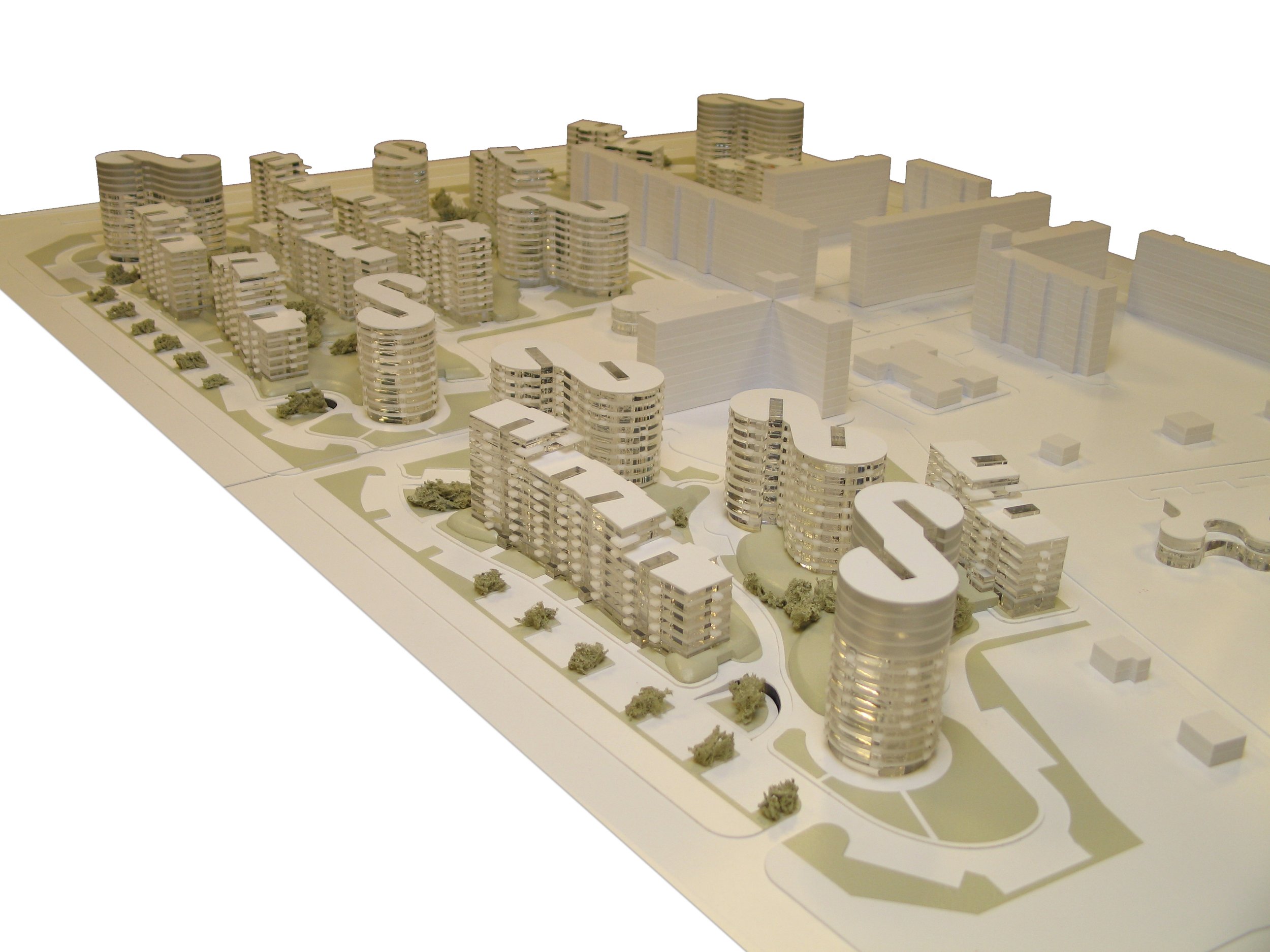Architectural scale model of a modern residential development with curved multi-story apartment buildings, green spaces, and roads.