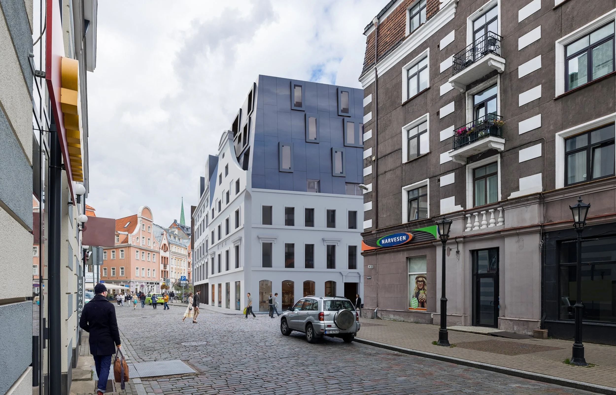 City street with modern and traditional buildings, cobblestone road, pedestrians, and parked car.