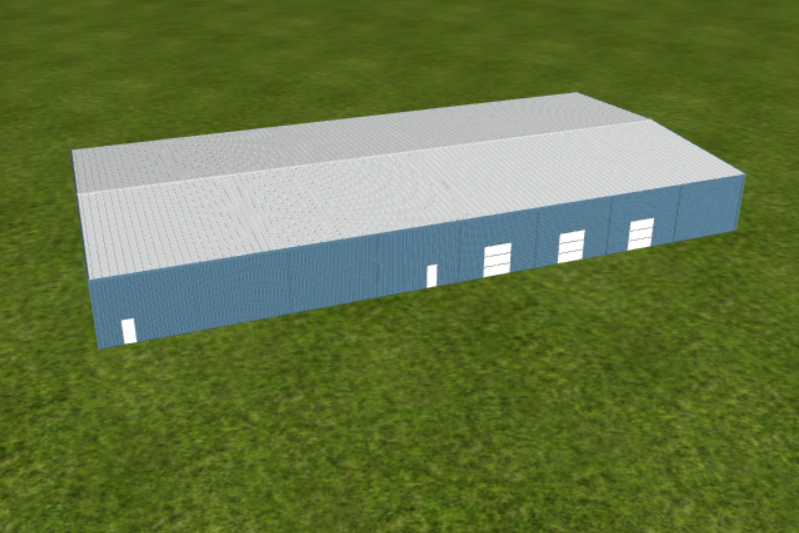 A large rectangular building with a blue exterior and a silver roof, situated on a grassy field.
