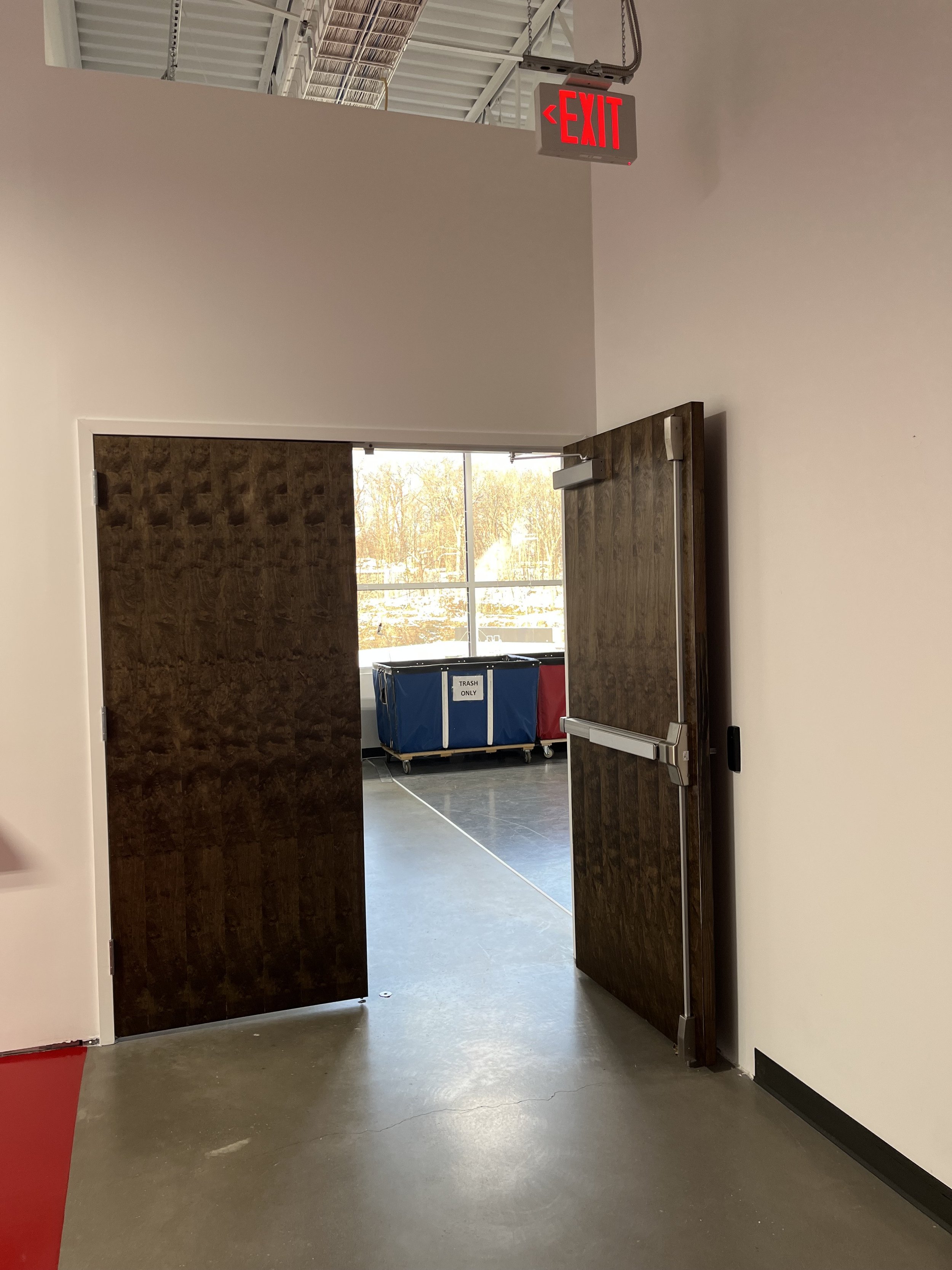 Installed heavy-duty steel security door at THOR Labs facility, designed for controlled access and enhanced building security.