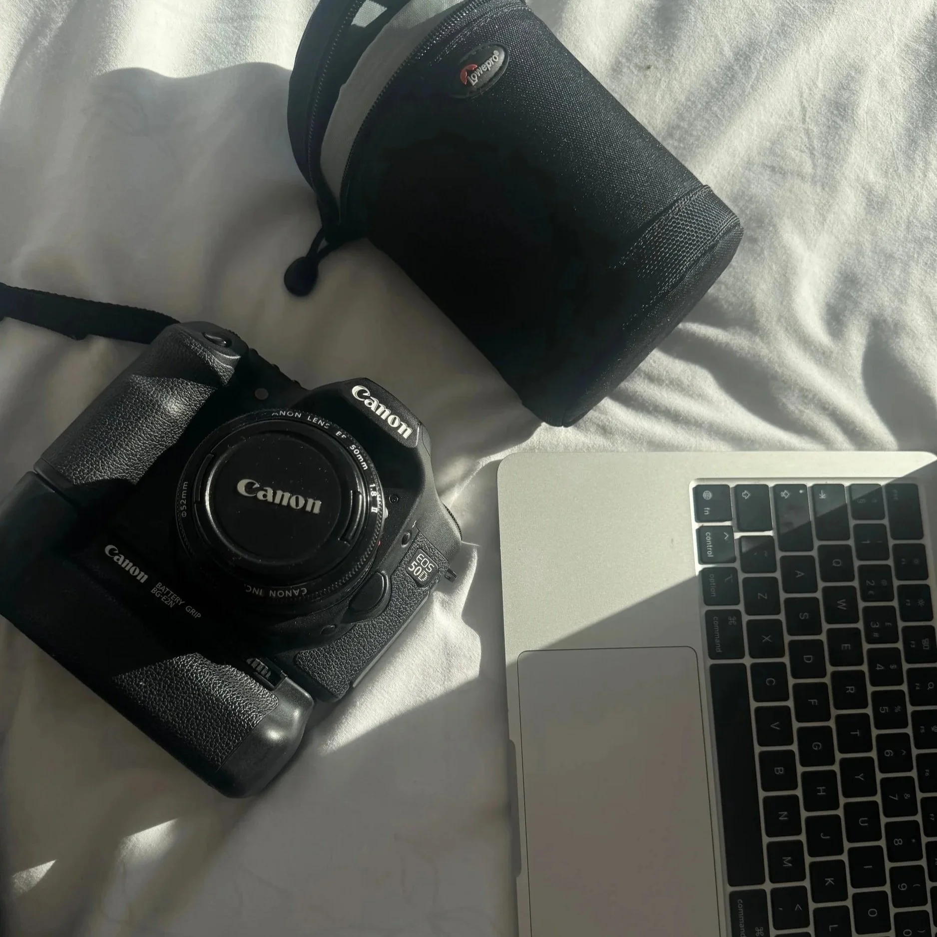 Professional photography and content creation equipment including camera, laptop and gear used for social media production and brand storytelling.