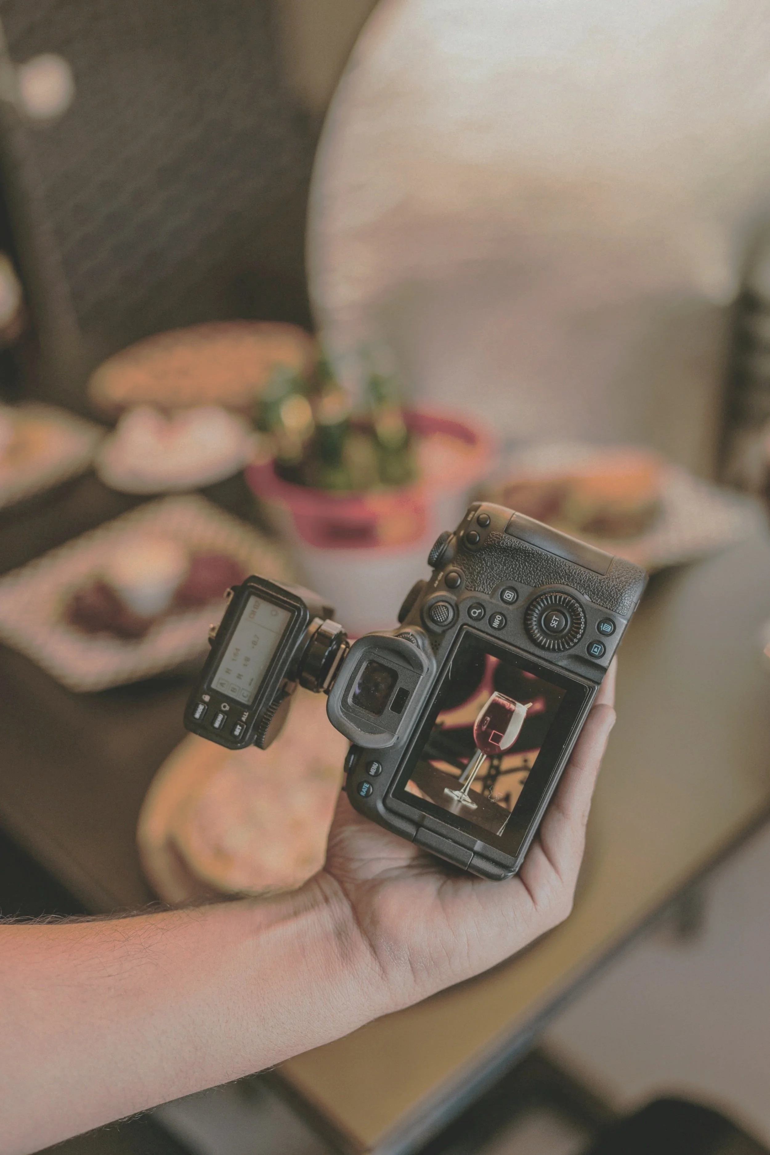 Behind the scenes professional photography moment capturing content using DSLR camera for social media marketing and brand storytelling.