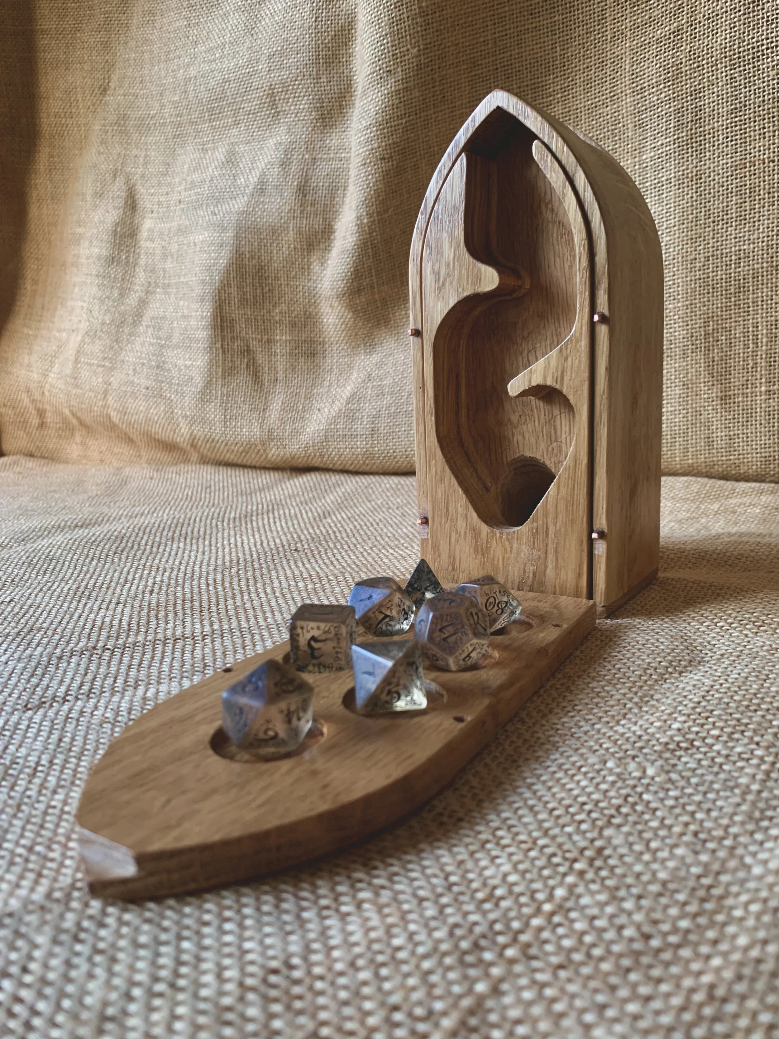 Box lid holds dice and the tower converts into a dice tower
