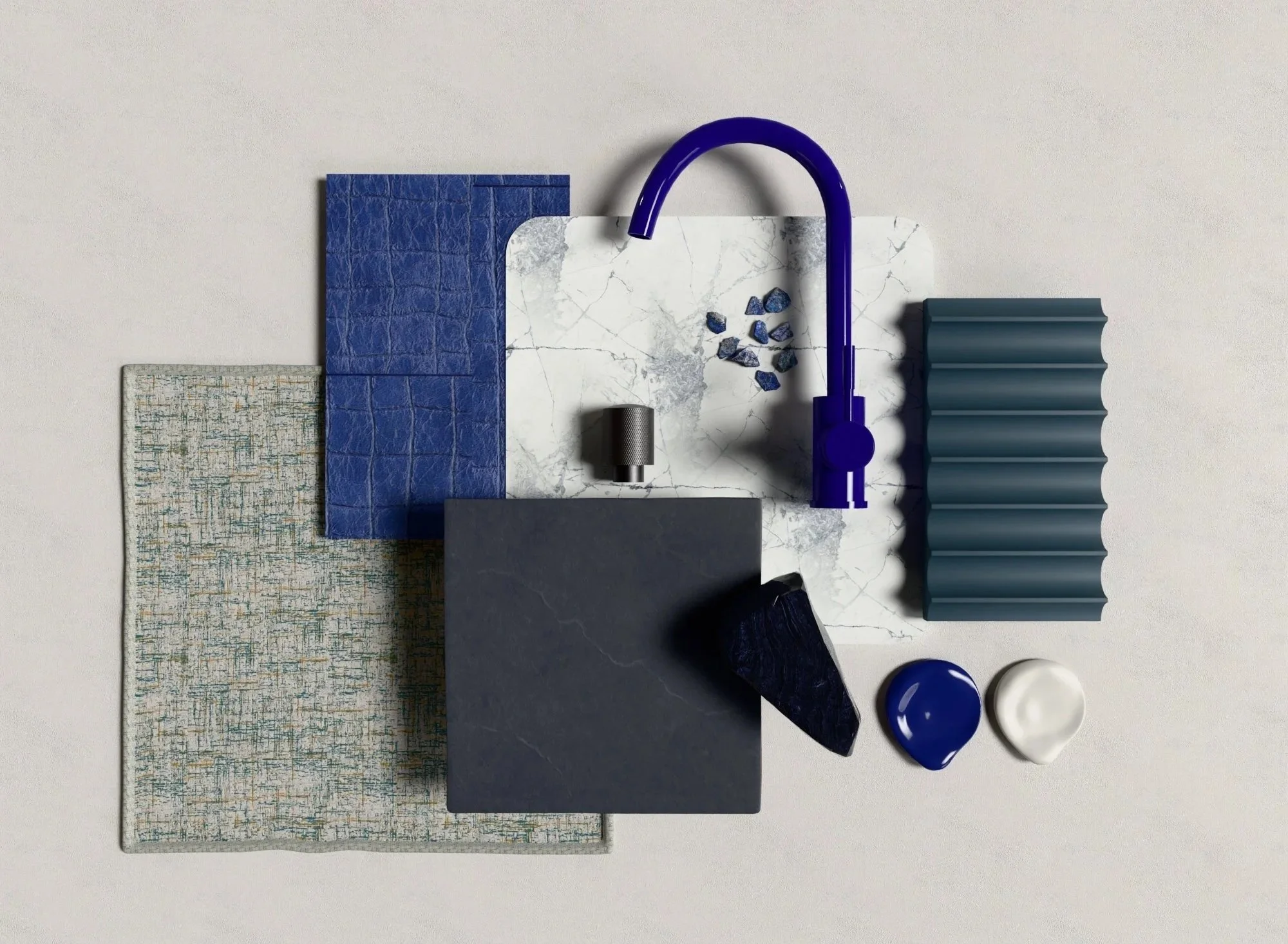 Mood board or sample palette of various textured materials including ceramic tiles, marble, stone, and fabric, with a blue faucet and small decorative objects.