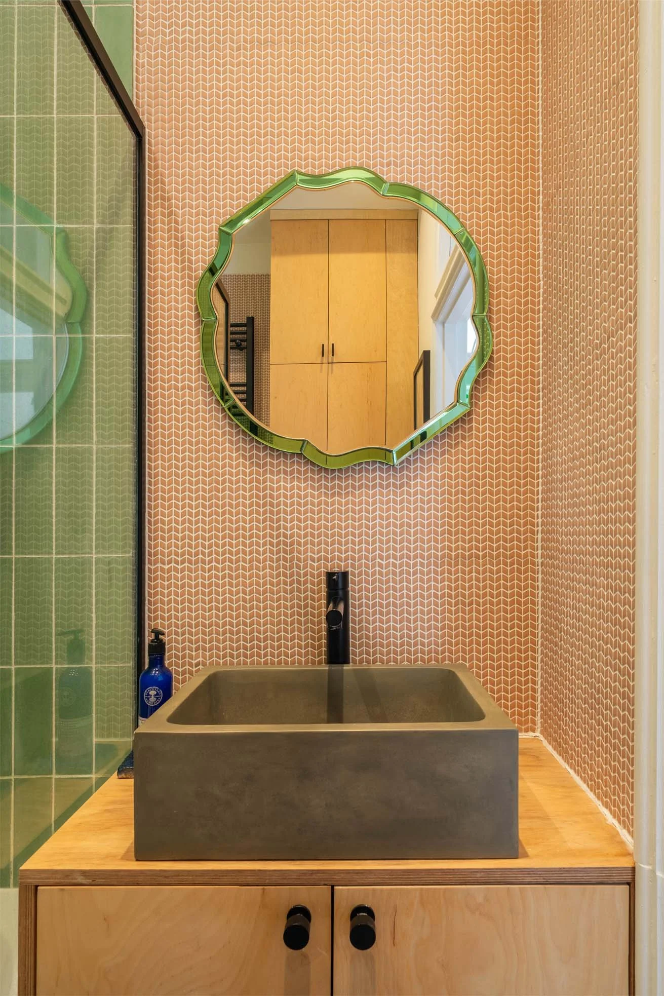 Green and Pink Tiles with Plywood Bathroom
