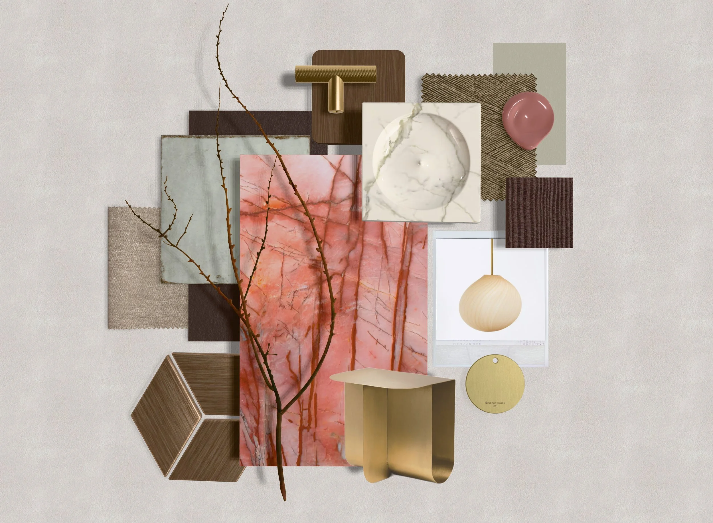A collection of textured and colored material samples, including fabric, wood, stone, and metal, arranged on a light background with a small, leafless branch.