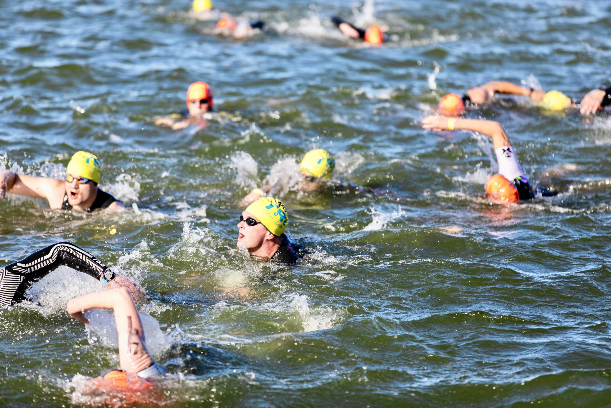 Can you spot Coach Karin? 
Hint: High elbow recovery, gliding through the chop like it's just another day in the lake.