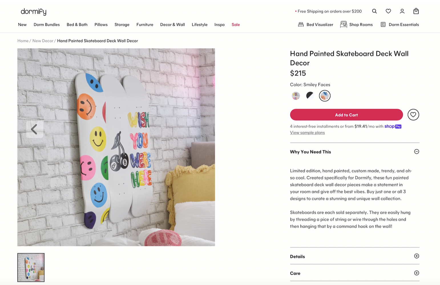 Colorful, hand-painted skateboard deck wall decor with smiley face designs, mounted on a white brick wall in a bedroom setting.