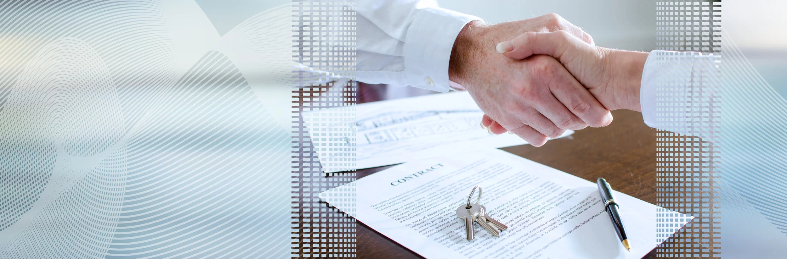 Two people shaking hands over a contract and keys on a table, with a pen nearby.