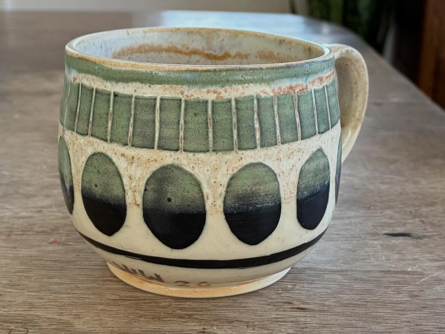 Mugs! I love the way the glaze interacts with the mason stain. I&rsquo;ll be making more of these! #handmademugsmakecoffeebetter🌿☕️🌿 #mpls2026 #sgraffitopottery