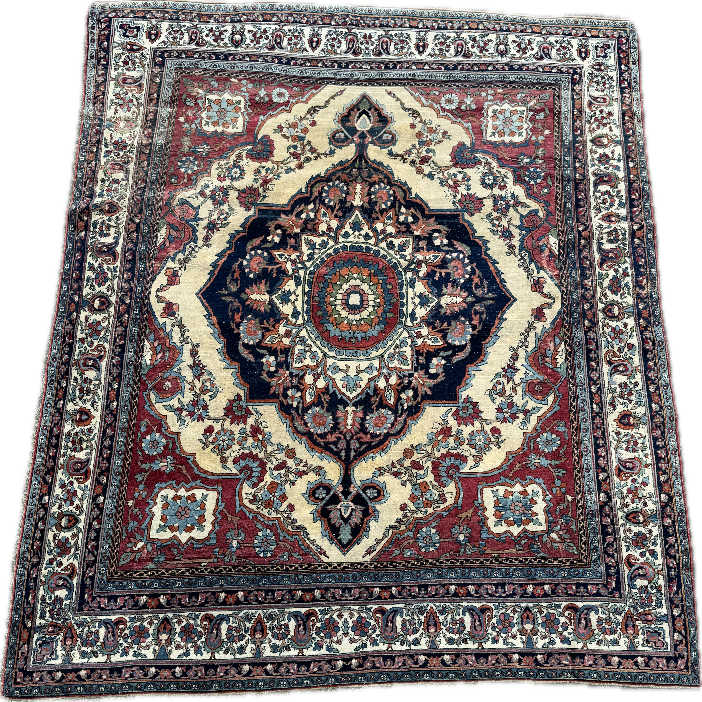 Traditional Persian-style area rug with intricate floral and geometric patterns in red, navy, cream, and light blue colors.