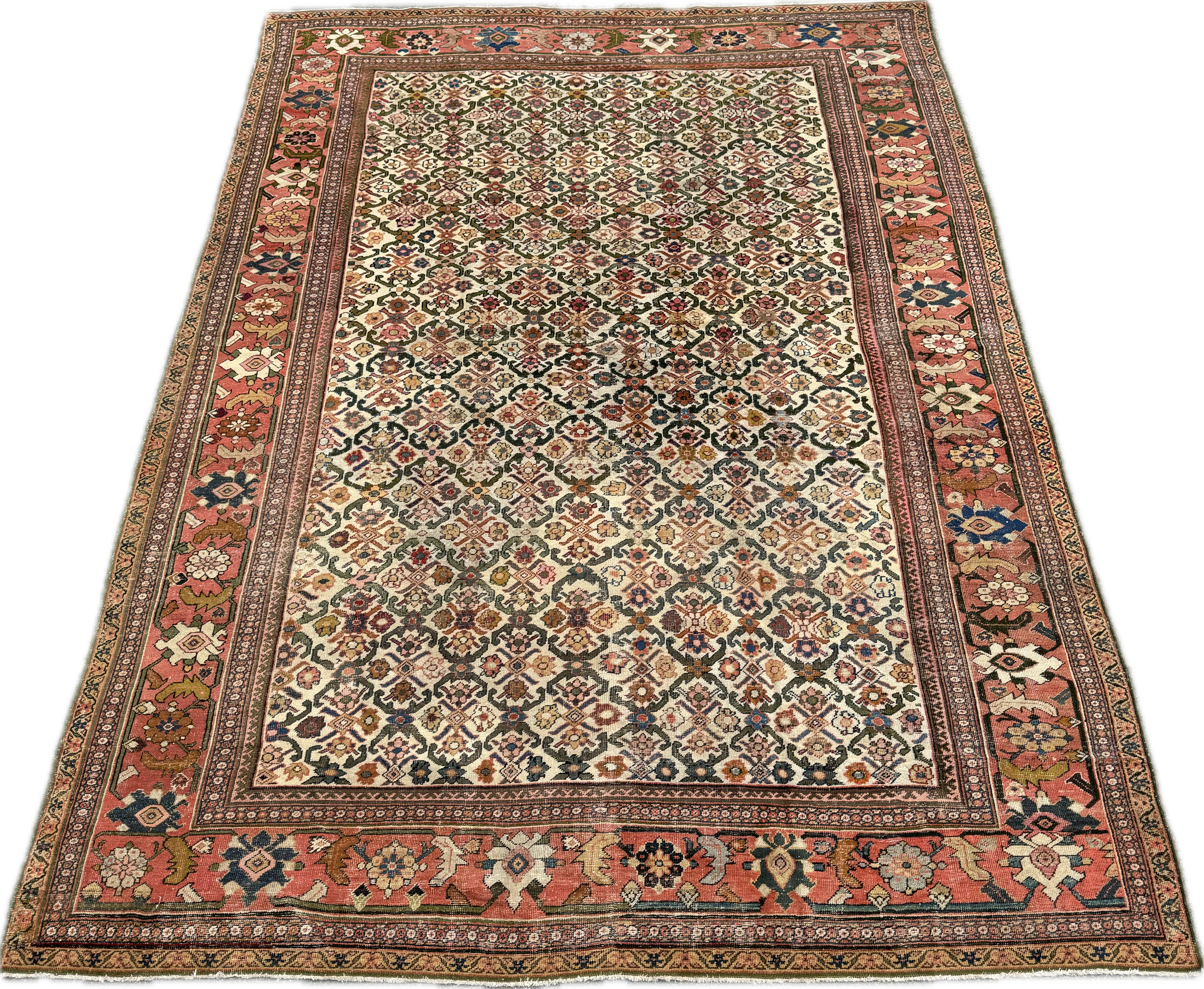 An ornate, multicolored Persian-style area rug with floral and geometric patterns in red, cream, black, pink, and blue hues.