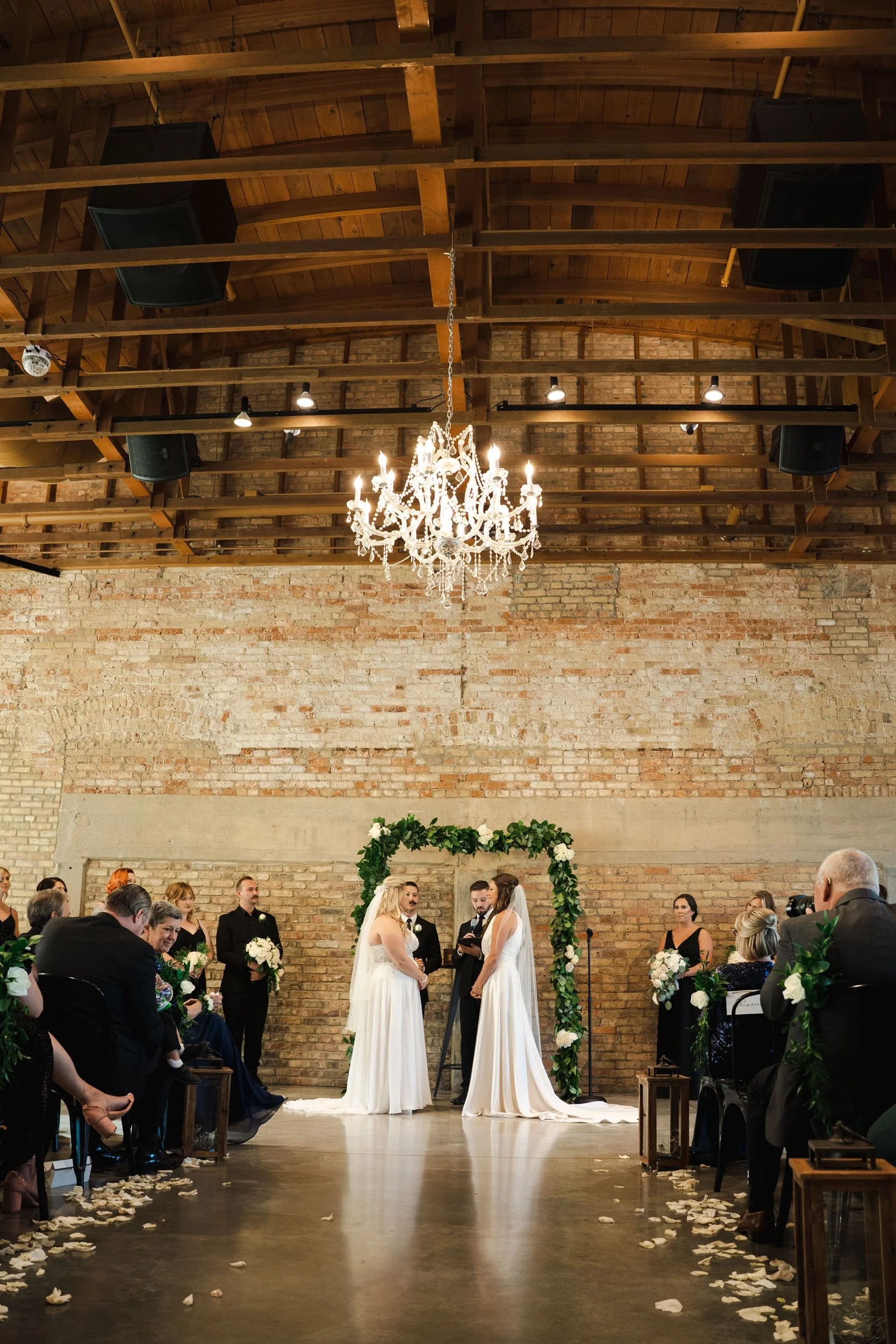 Two beautiful brides during their wedding ceremony at the Brix in Carpentersville, IL.