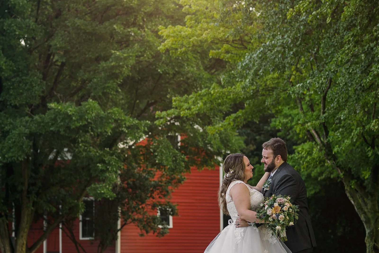 A couple embraces for portraits at Blackberry Farm in Aurora, IL.