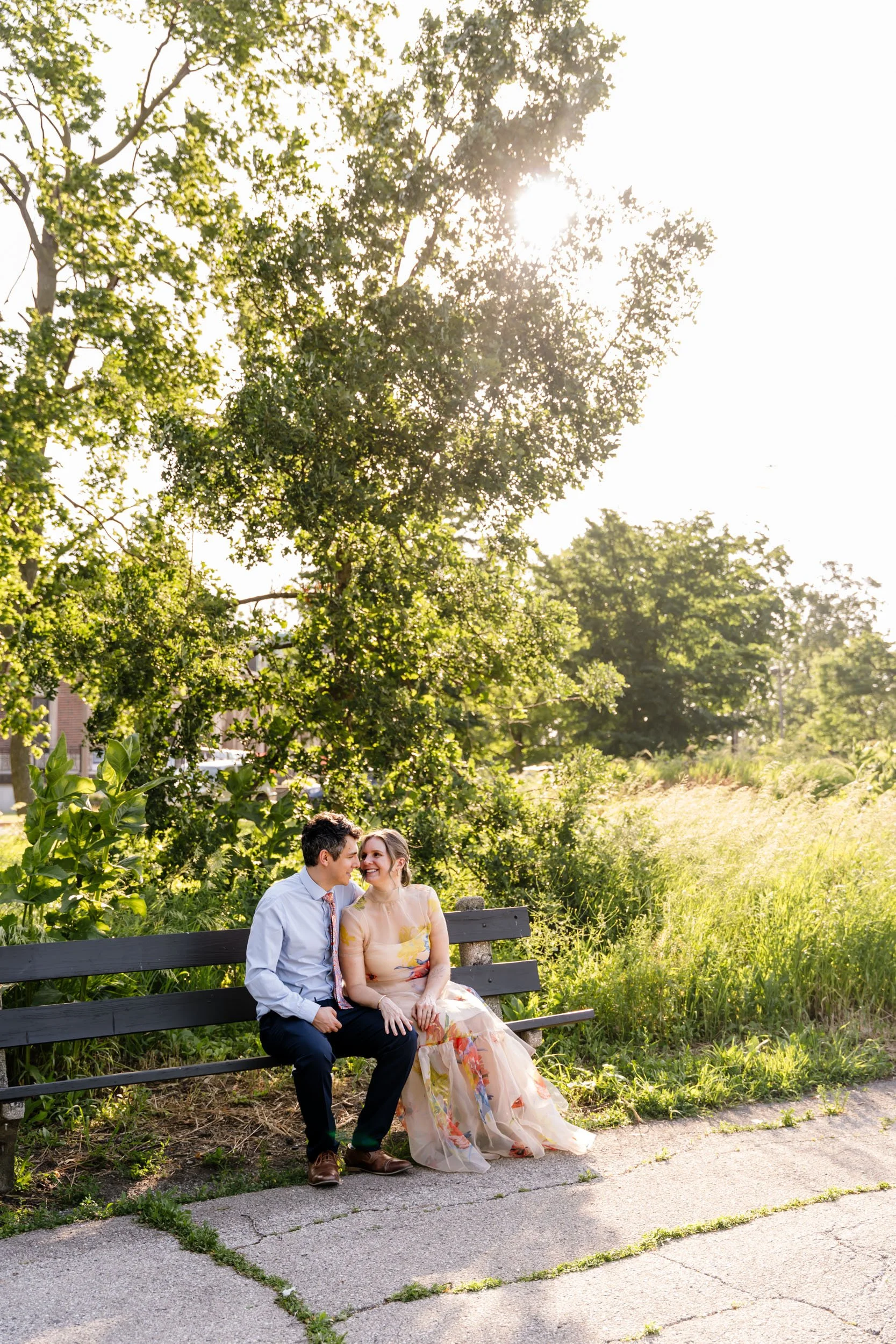 A couple sits on a bench for photos in Chicago, IL.