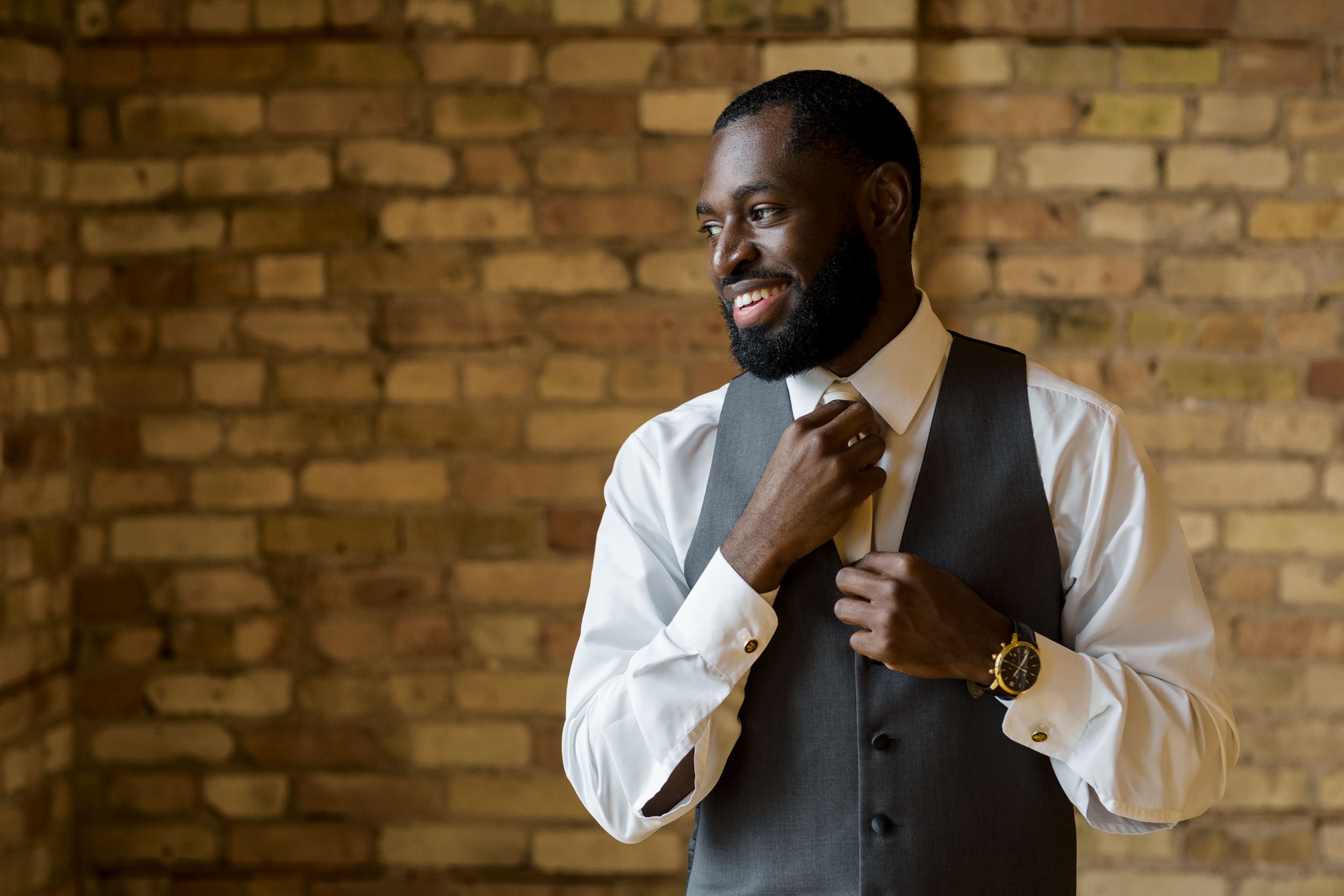 A groom poses for photos before his ceremony in Elgin, IL.