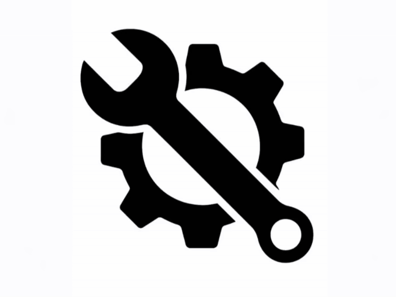 Ícono en negro de una llave y una rueda dentada, simbolizando configuración o reparación.