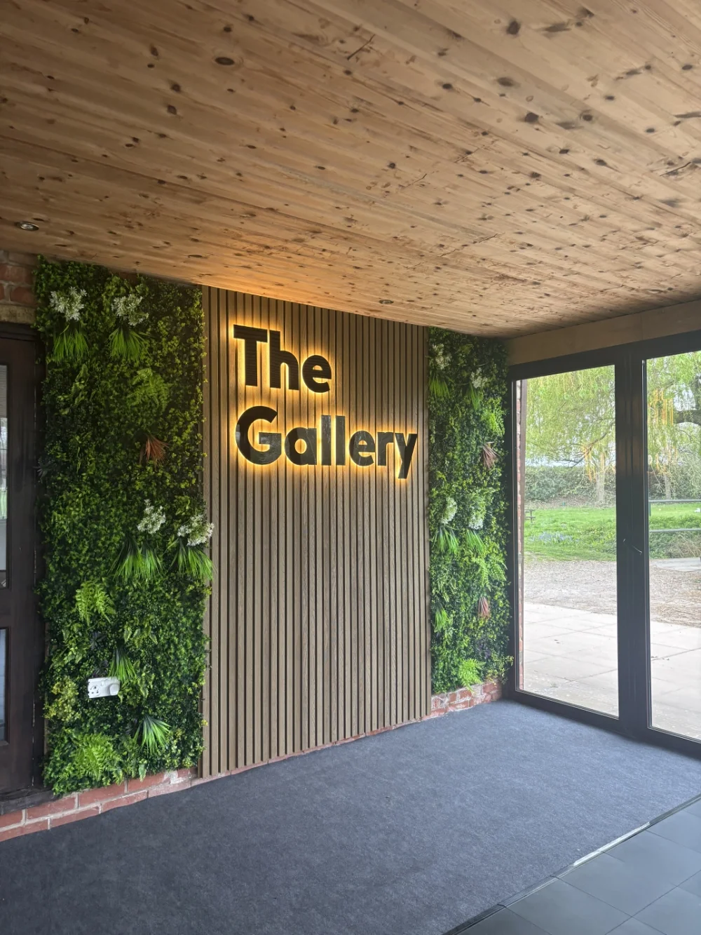 Bespoke illuminated feature wall with custom signage