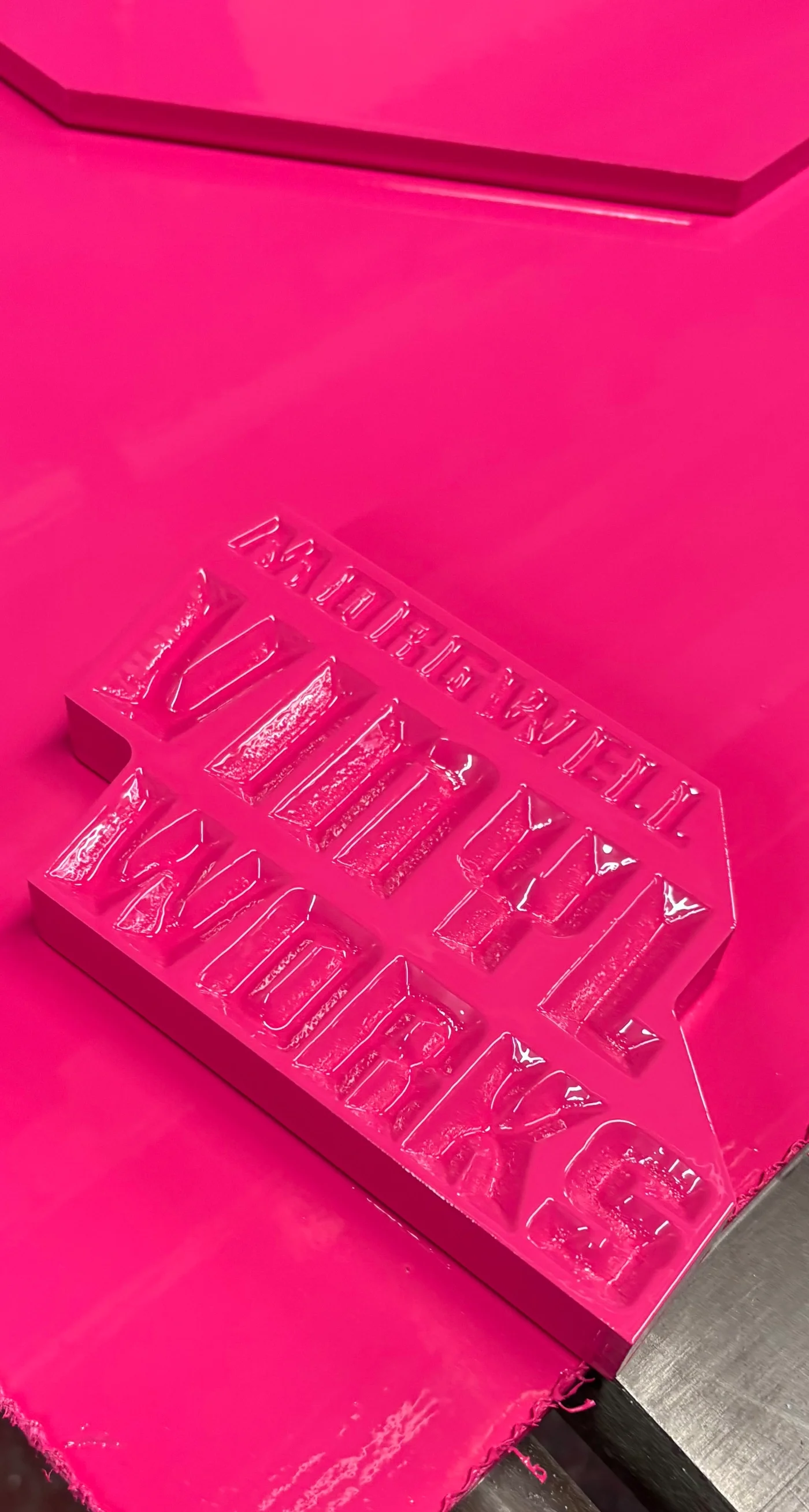 Luminous pink 3d feature sign for an office wall or shelf