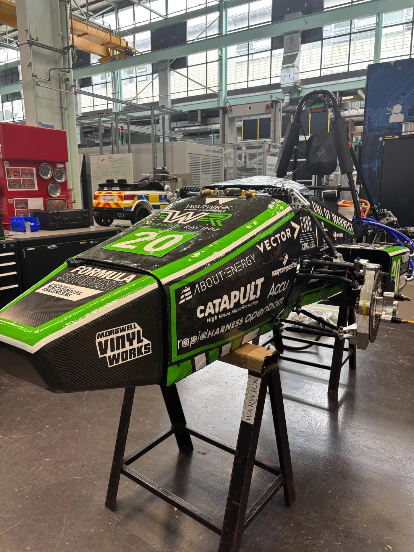 Warwick Racing car wrapped in green with sponsor logos