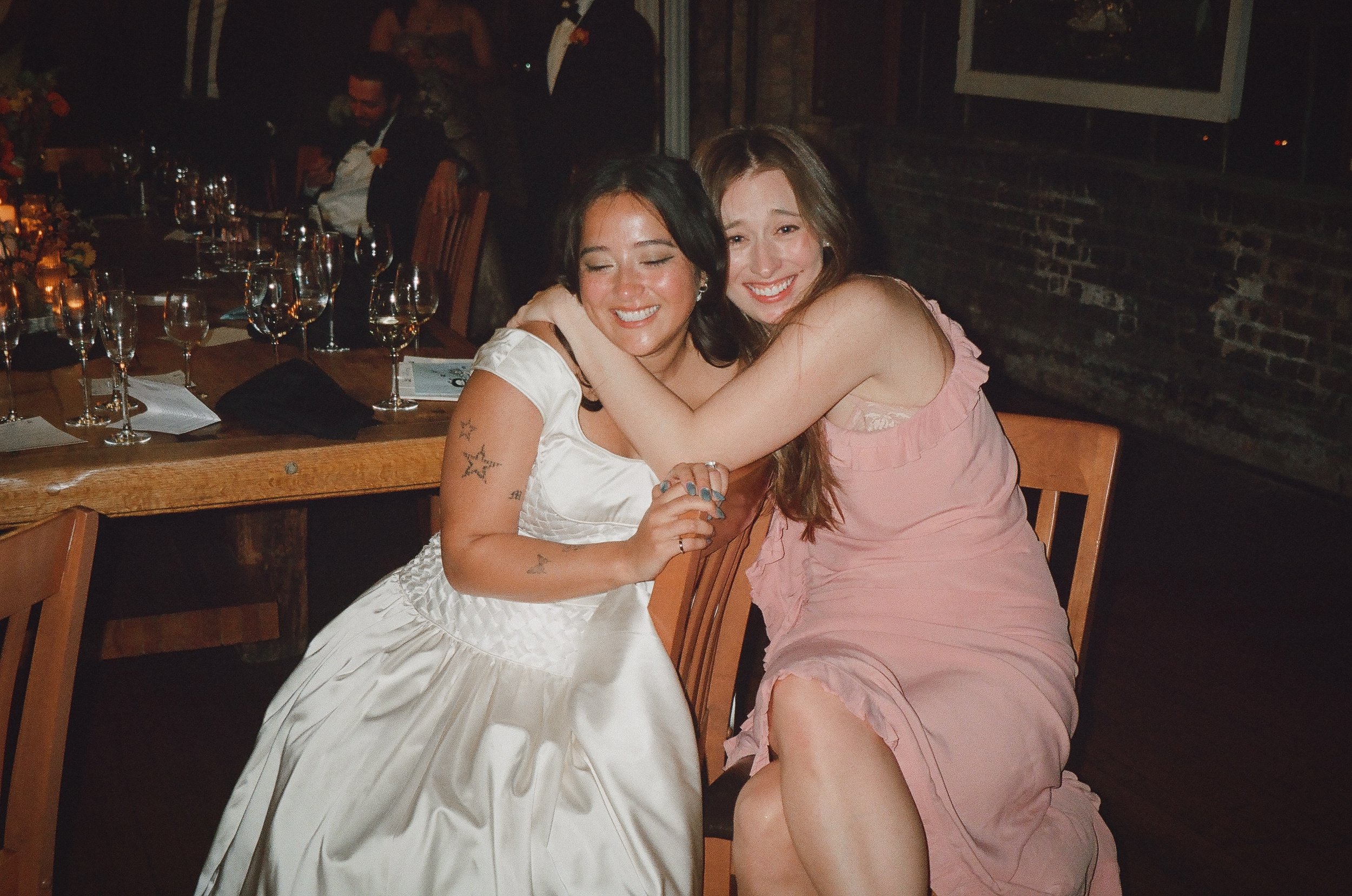 Bride and groom get married in Chicago at Salvage One, with creative, lively wedding focused on community, family, laughter. Documentary and candid photos on analog nostalgic film. Weddings by Grace is a Chicago lesbian queer luxury wedding photograp