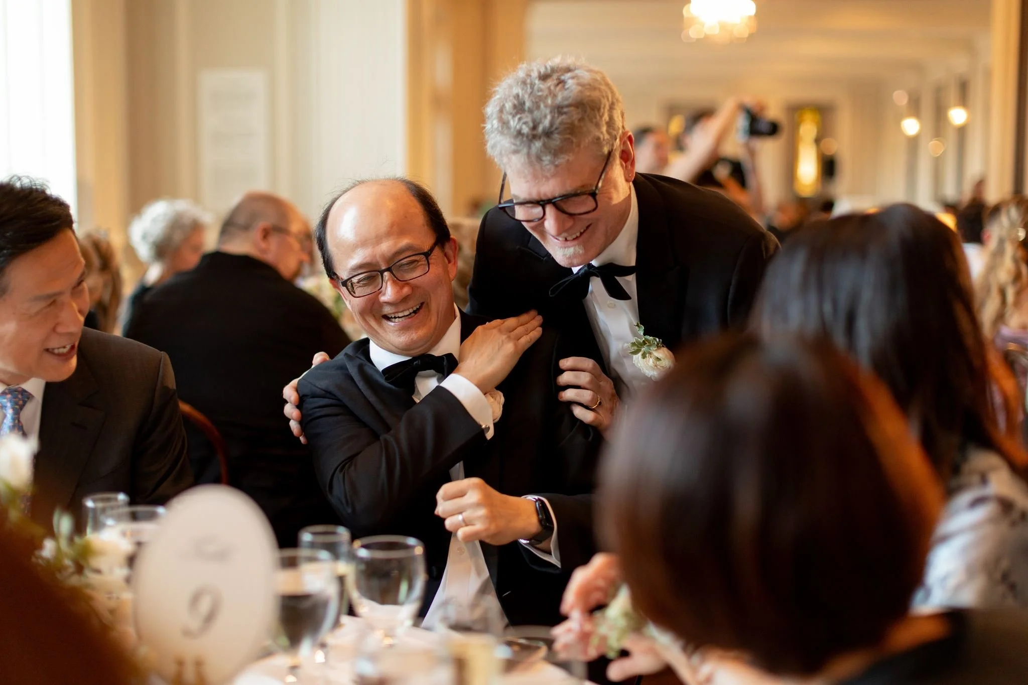 Bride and groom get married at the Chicago History Museum, with creative, lively wedding focused on community, family, laughter. Documentary and candid photos on analog nostalgic film. Weddings by Grace is a Chicago lesbian queer luxury wedding photo