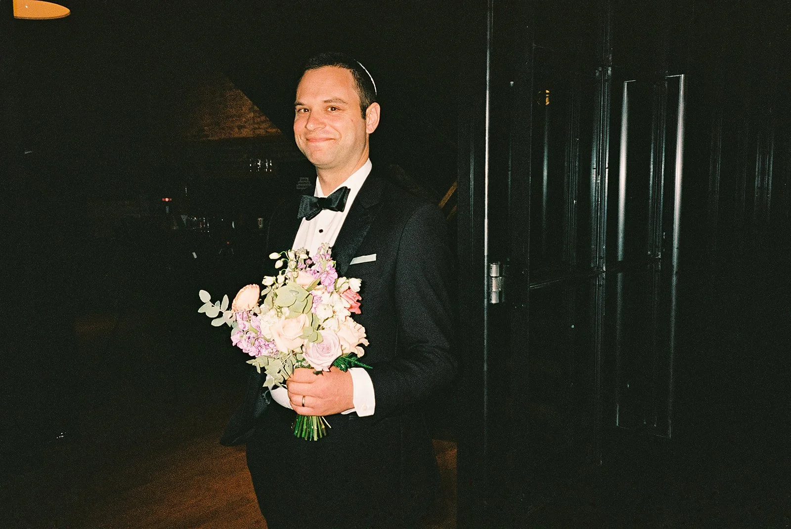 Bride and groom get married in Chicago at WildmanBT, with creative, lively wedding focused on community, family, laughter. Documentary and candid photos on flash film. Weddings by Grace is a Chicago lesbian queer luxury wedding photographer specializ