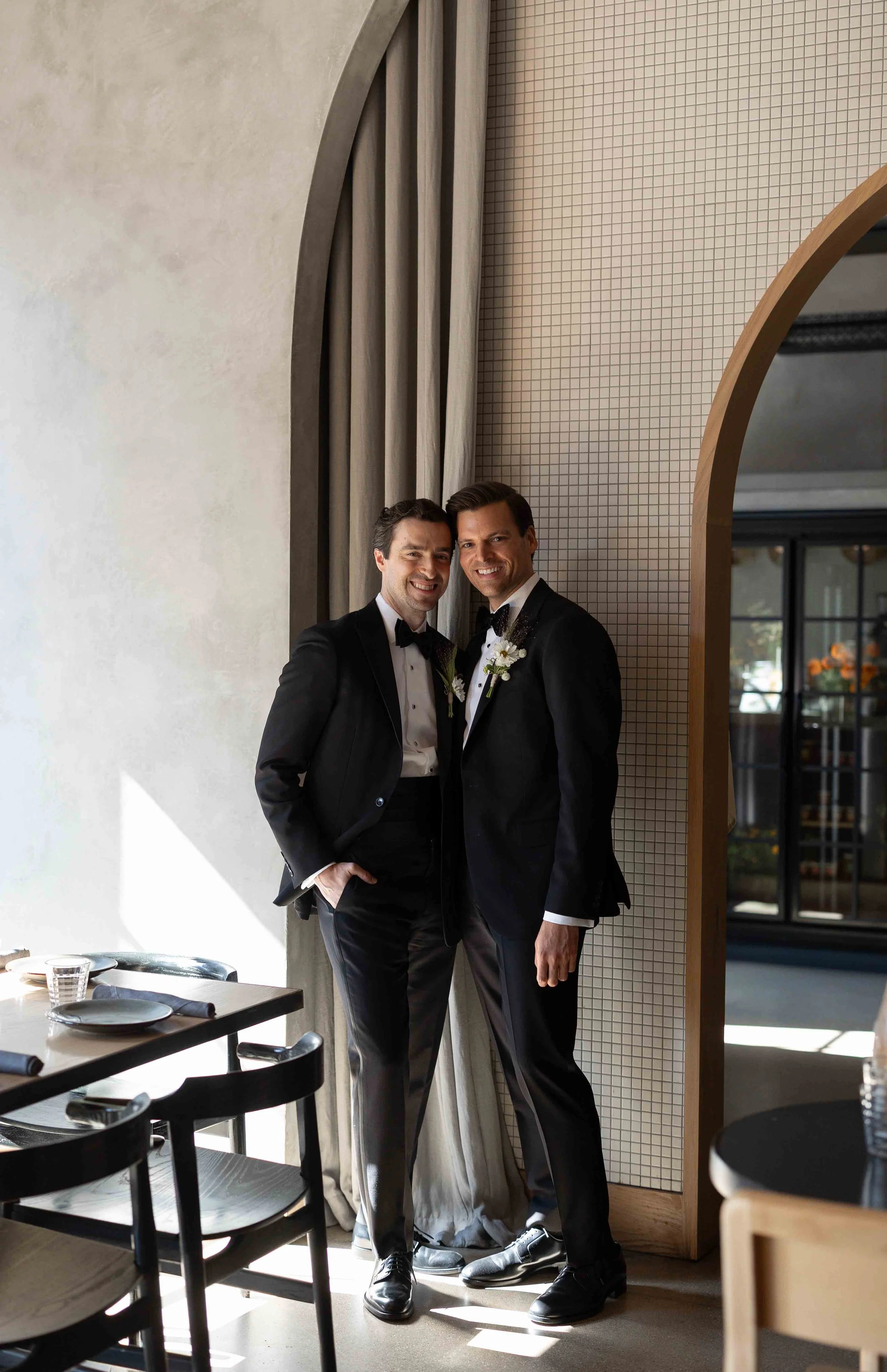 Groom and groom get married at maxwells trading with creative, lively wedding focused on community, queer family, laughter. Documentary and candid photos on analog nostalgic film. Weddings by Grace is a Chicago lesbian queer luxury wedding photograph