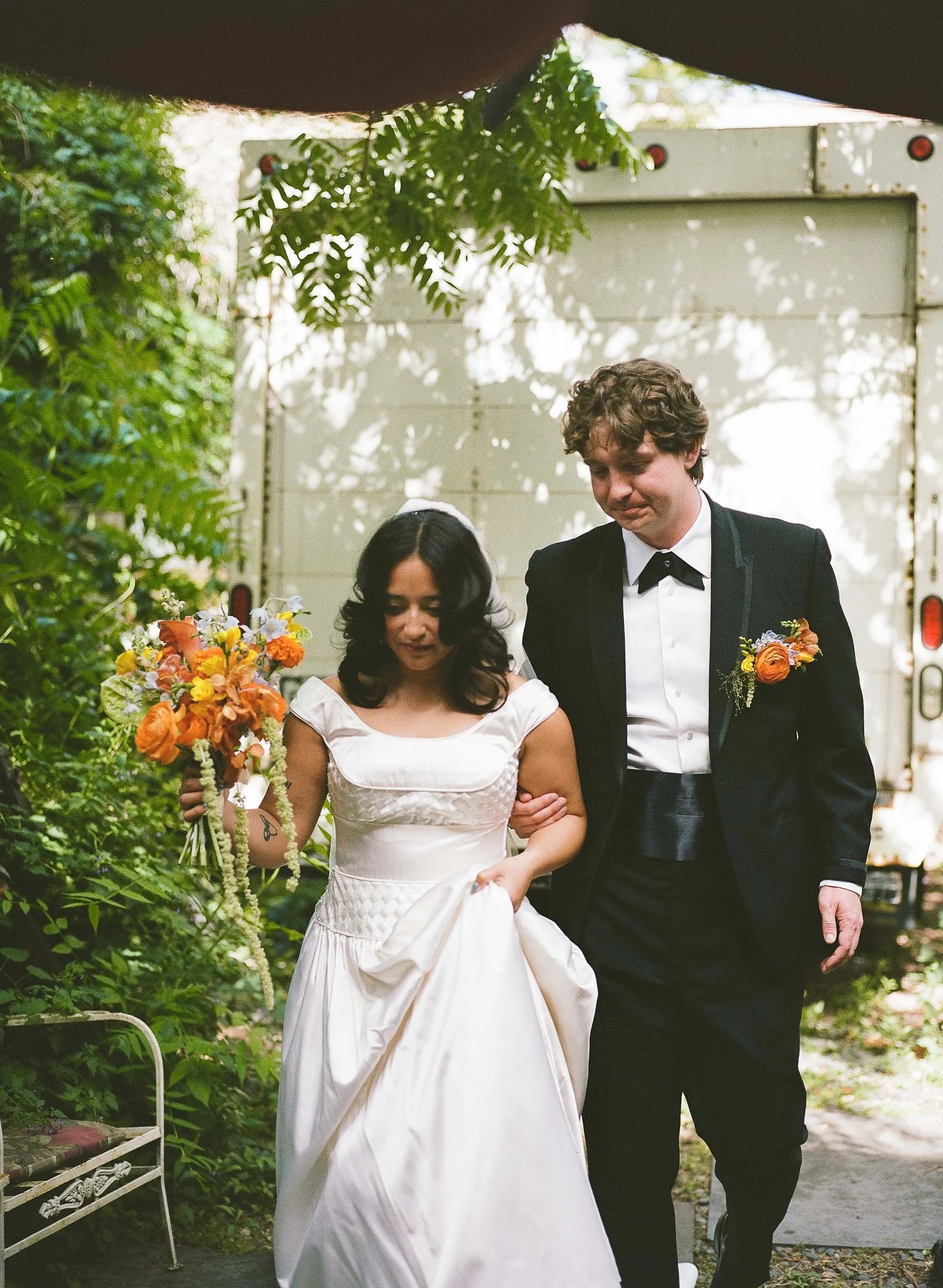 Bride and groom get married in Chicago at Salvage One, with creative, lively wedding focused on community, family, laughter. Documentary and candid photos on analog nostalgic film. Weddings by Grace is a Chicago lesbian queer luxury wedding photograp