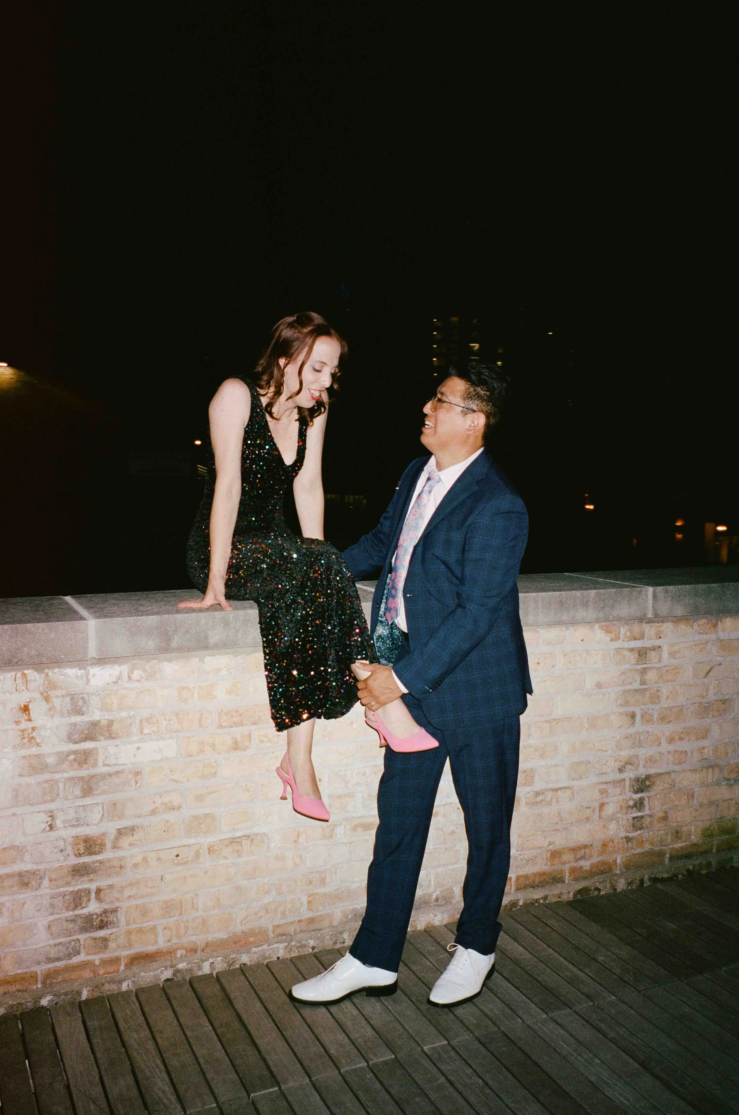 Groom and groom get married at maxwells trading with creative, lively wedding focused on community, queer family, laughter. Documentary and candid photos on analog nostalgic film. Weddings by Grace is a Chicago lesbian queer luxury wedding photograph