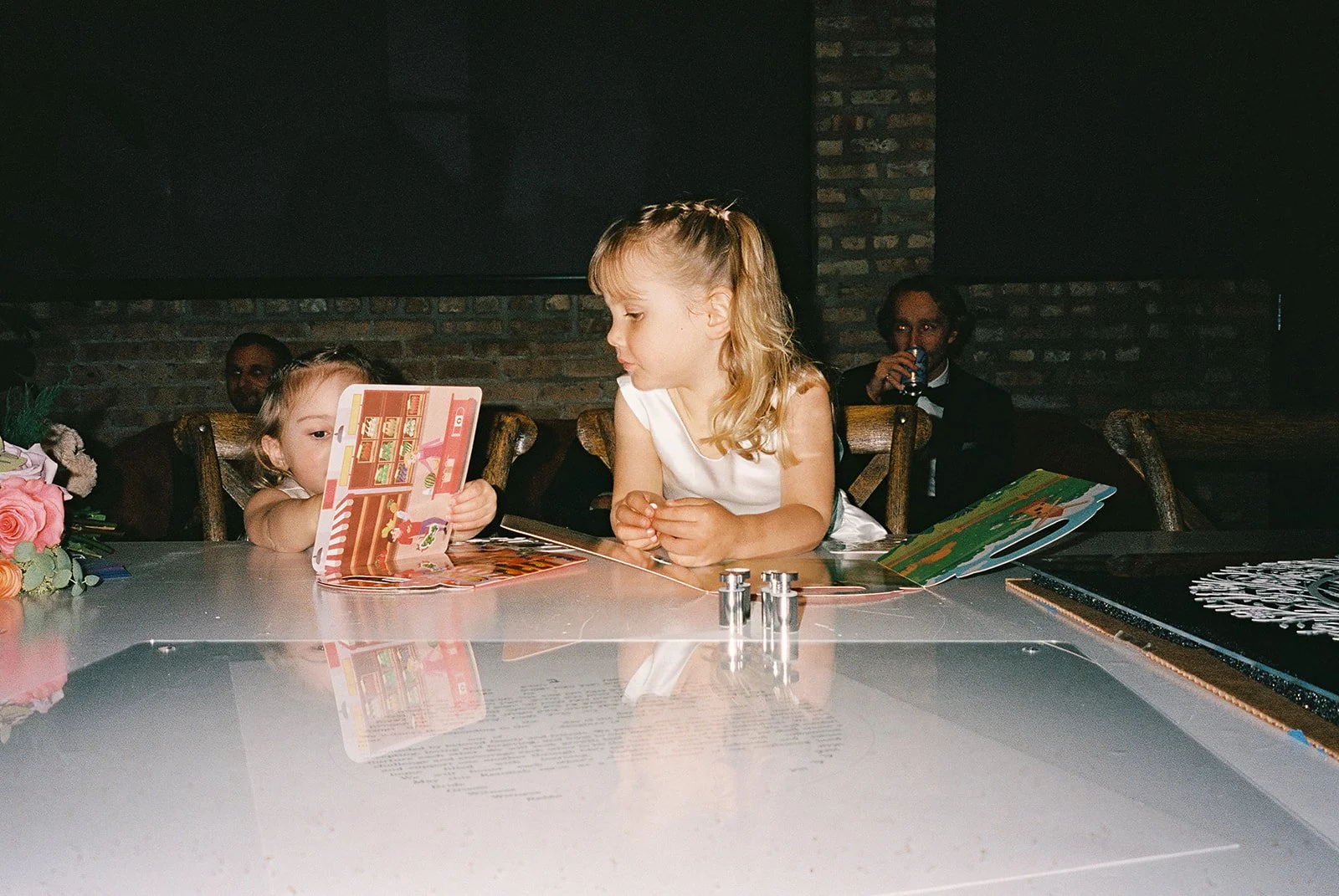 Bride and groom get married in Chicago at WildmanBT, with creative, lively wedding focused on community, family, laughter. Documentary and candid photos on flash film. Weddings by Grace is a Chicago lesbian queer luxury wedding photographer specializ