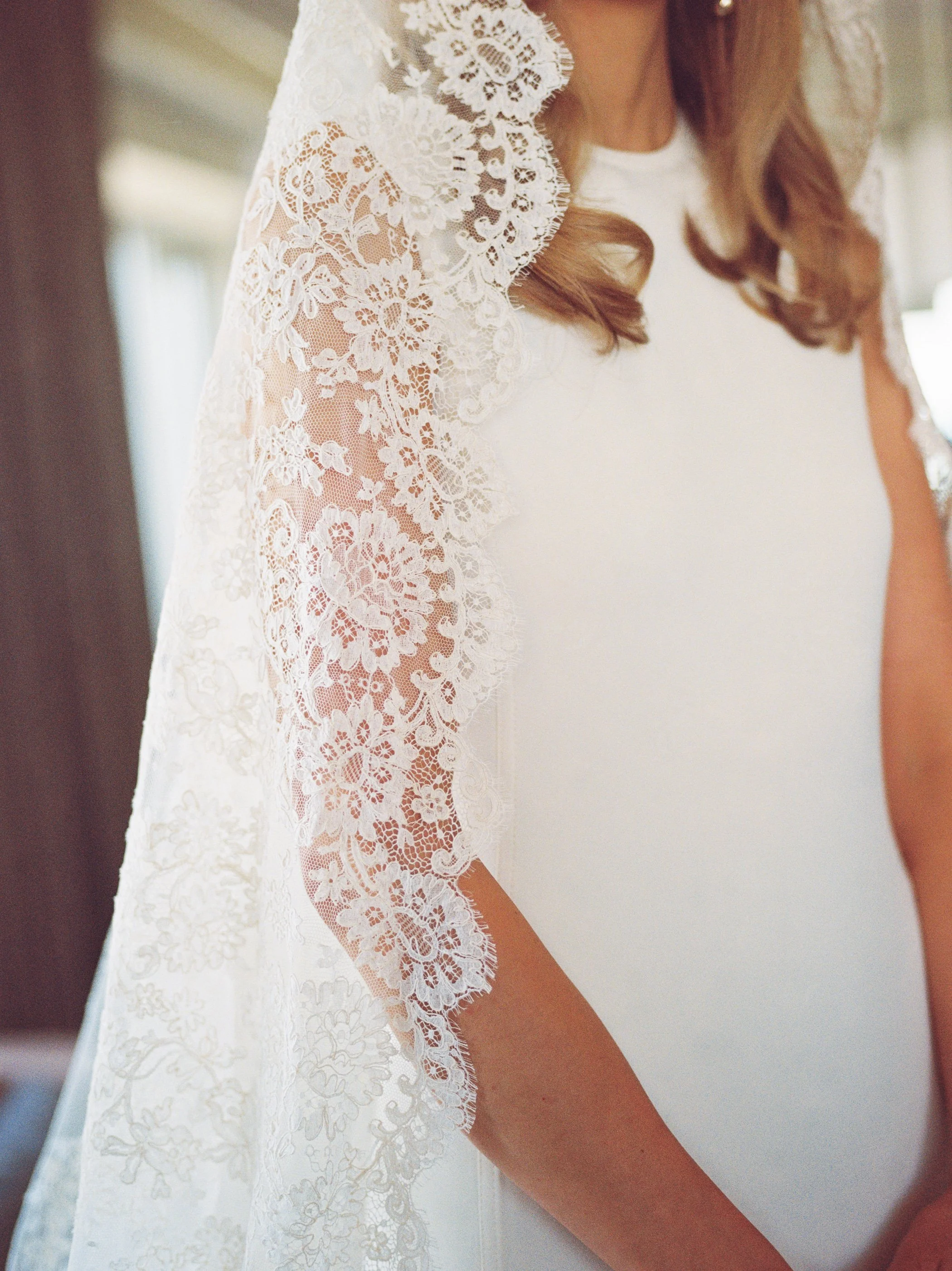 Close up film photo of soft, white veil. Weddings by Grace is a Chicago lesbian photographer specializing in portraits, candid, editorial, documentary, events, + weddings. Analog film wedding photography, queer-owned.