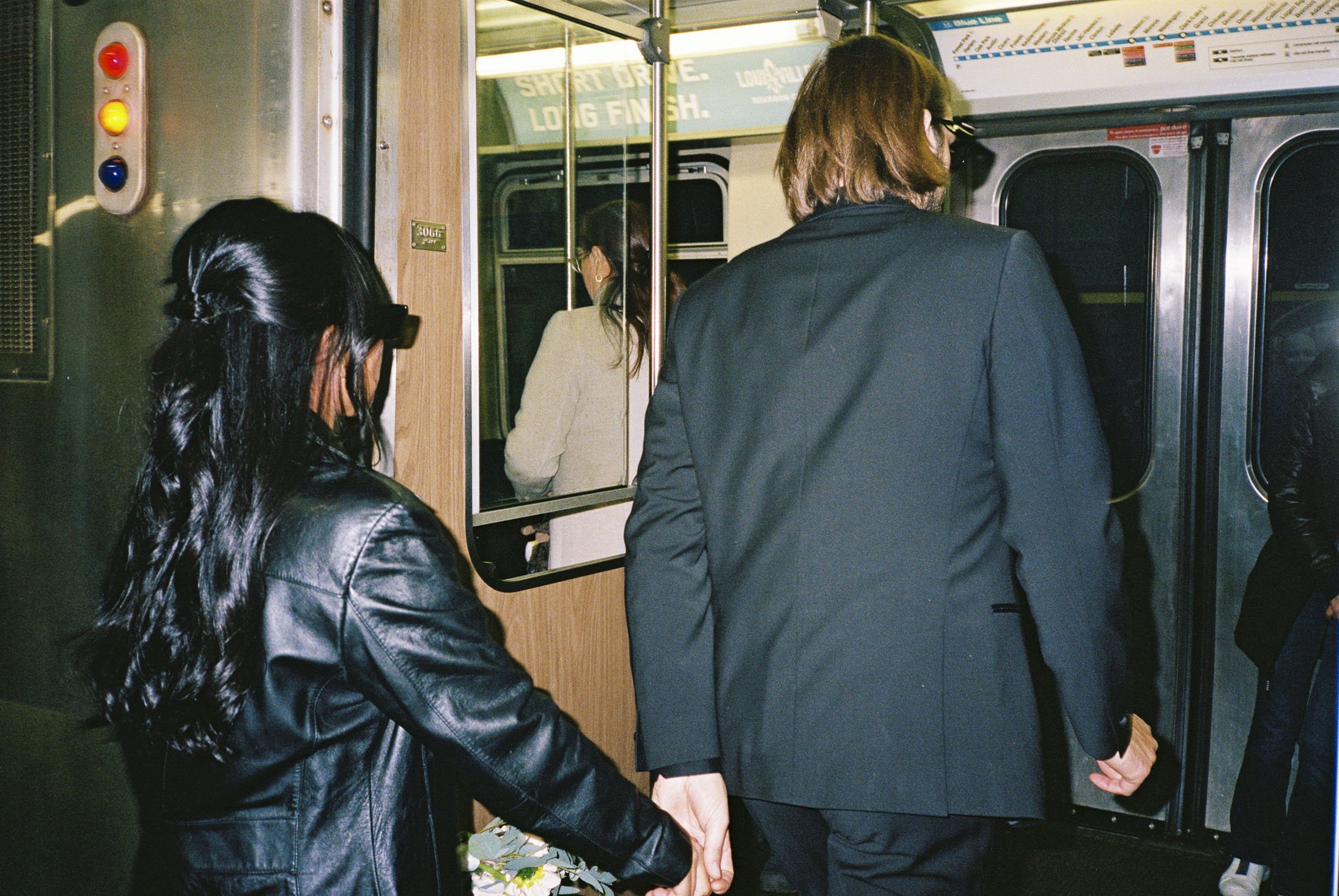 bride and groom board blue line train to logan square after City Hall Elopement in downtown chicago on film. Grace Coudal is a Chicago lesbian photographer specializing in portraits, candid, editorial, documentary, events, + weddings. Analog film wed