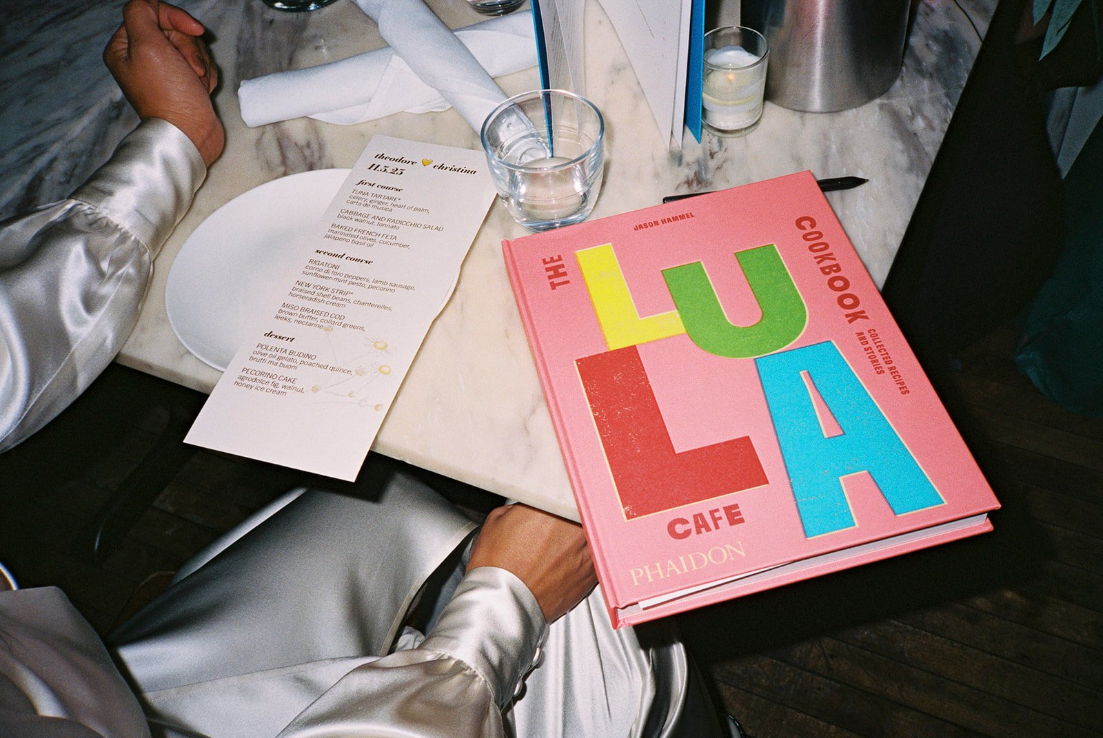 bride and groom in front of lula cafe for intimate wedding dinner after City Hall Elopement in downtown chicago on film. Grace Coudal is a Chicago lesbian photographer specializing in portraits, candid, editorial, documentary, events, + weddings. Ana