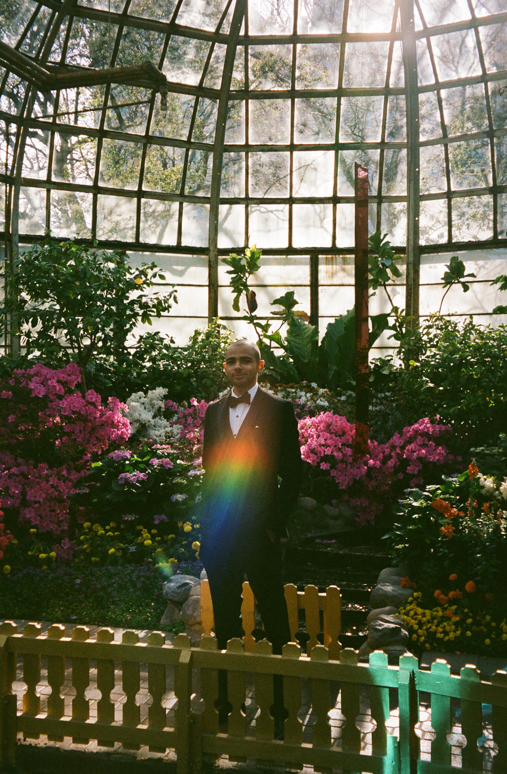 adam, the groom, waits for bride. Bride and Groom get married at Lincoln Park Conservatory and Salvatores. Grace Coudal is a Chicago lesbian photographer specializing in portraits, candid, editorial, documentary, events, + weddings. Analog film weddi