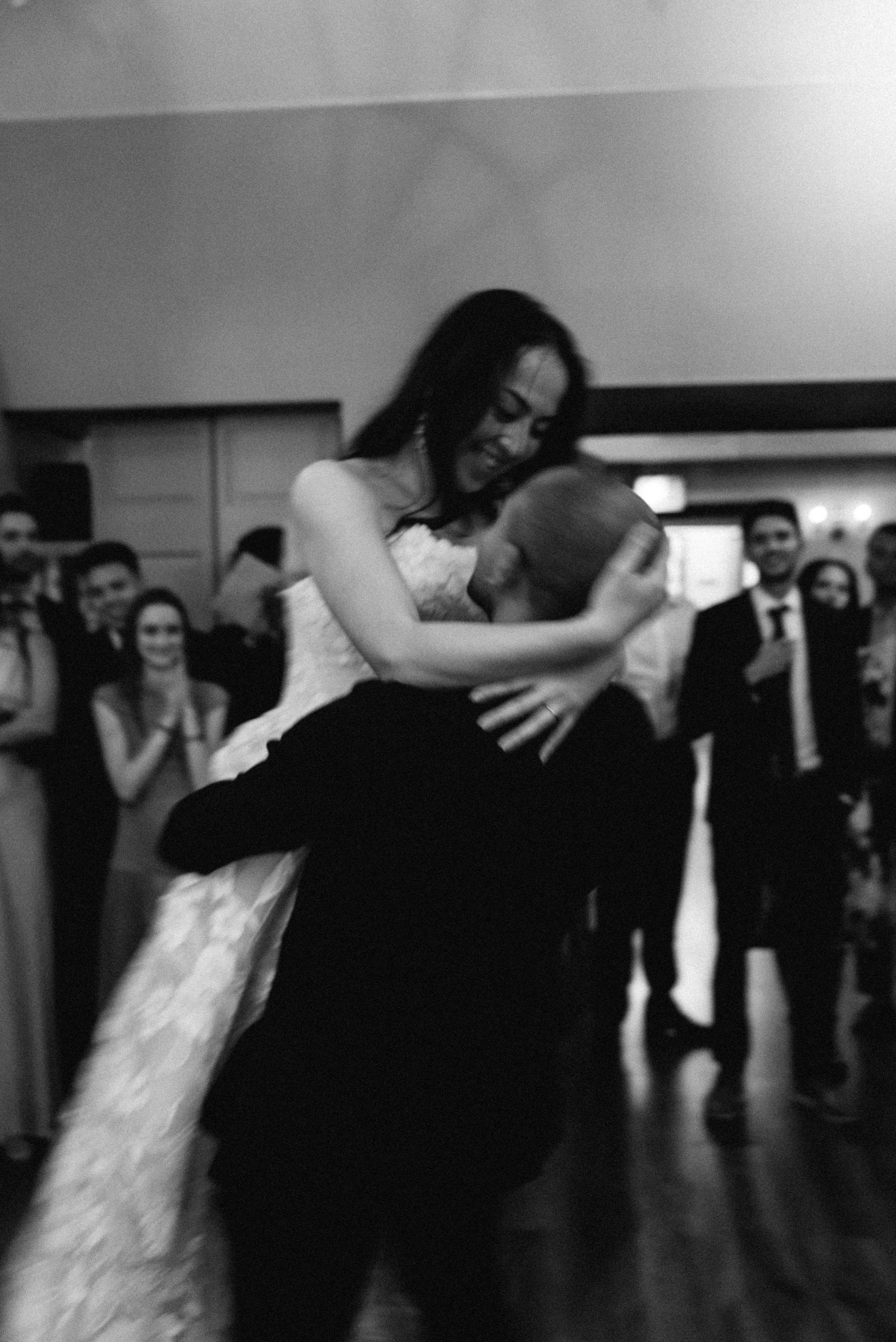 candid first dance photo. Bride and Groom marry at Lincoln Park Conservatory and Salvatores. Grace Coudal is a Chicago lesbian photographer specializing in portraits, candid, editorial, documentary, events, + weddings. Analog film wedding photography