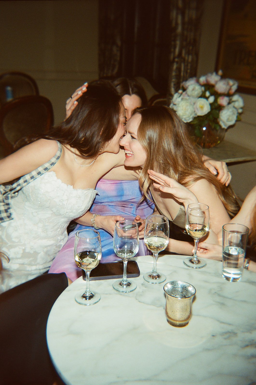 candid flash photo of reception on film. Bride and Groom marry at Lincoln Park Conservatory and Salvatores. Grace Coudal is a Chicago lesbian photographer specializing in portraits, candid, editorial, documentary, events, + weddings. Analog film wedd