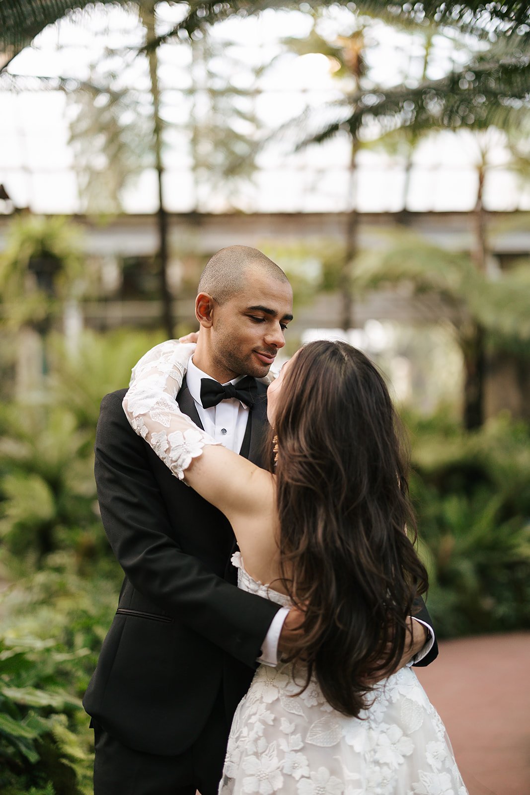 portraits of Bride and Groom get married at Lincoln Park Conservatory and Salvatores. Grace Coudal is a Chicago lesbian photographer specializing in portraits, candid, editorial, documentary, events, + weddings. Analog film wedding photography, queer