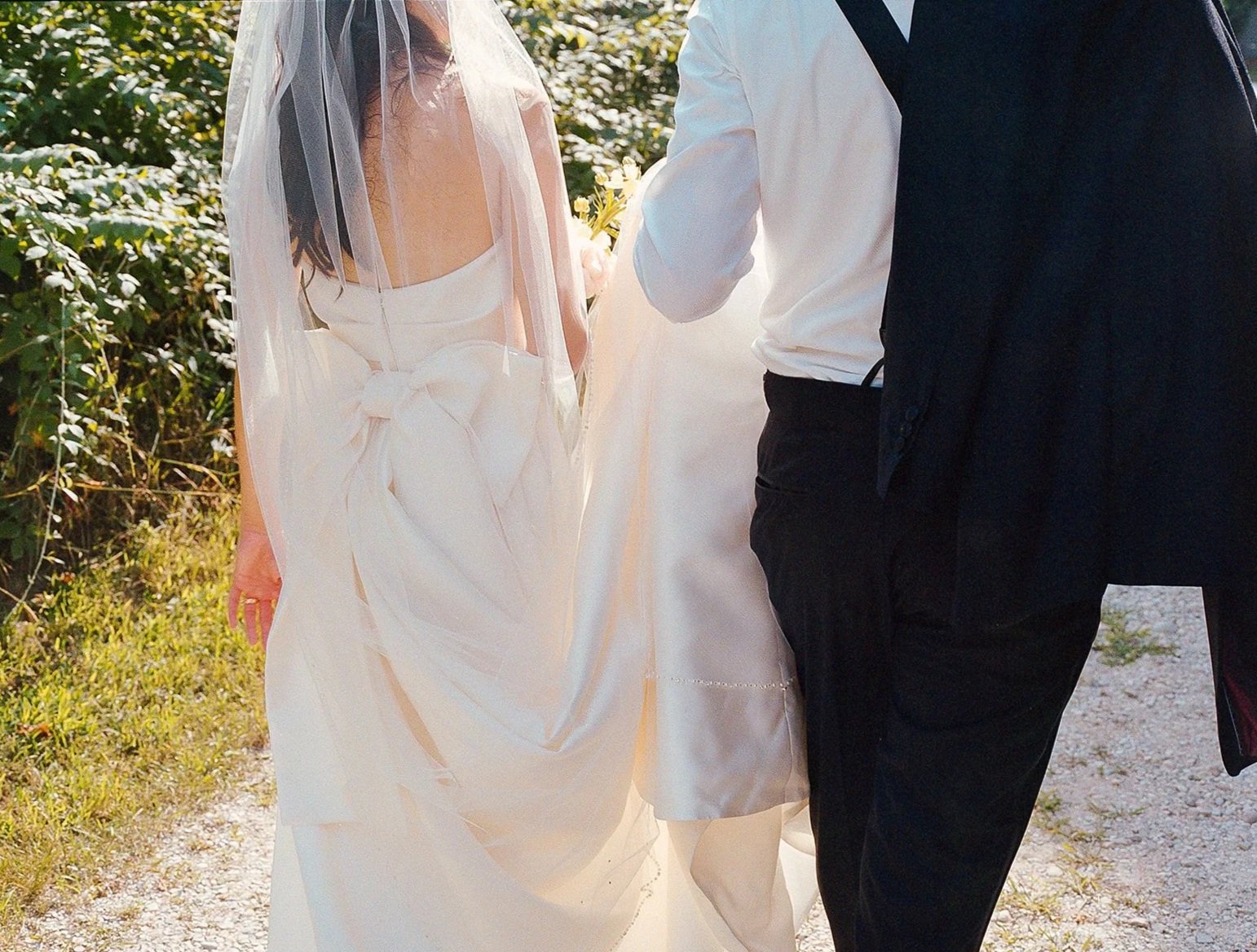 Bride and groom get married at the Millcreek Wilde in St. Joseph, Michigan. Grace Coudal is a Chicago lesbian photographer specializing in portraits, candid, editorial, documentary, events, + weddings. Analog film wedding photography, queer-owned.