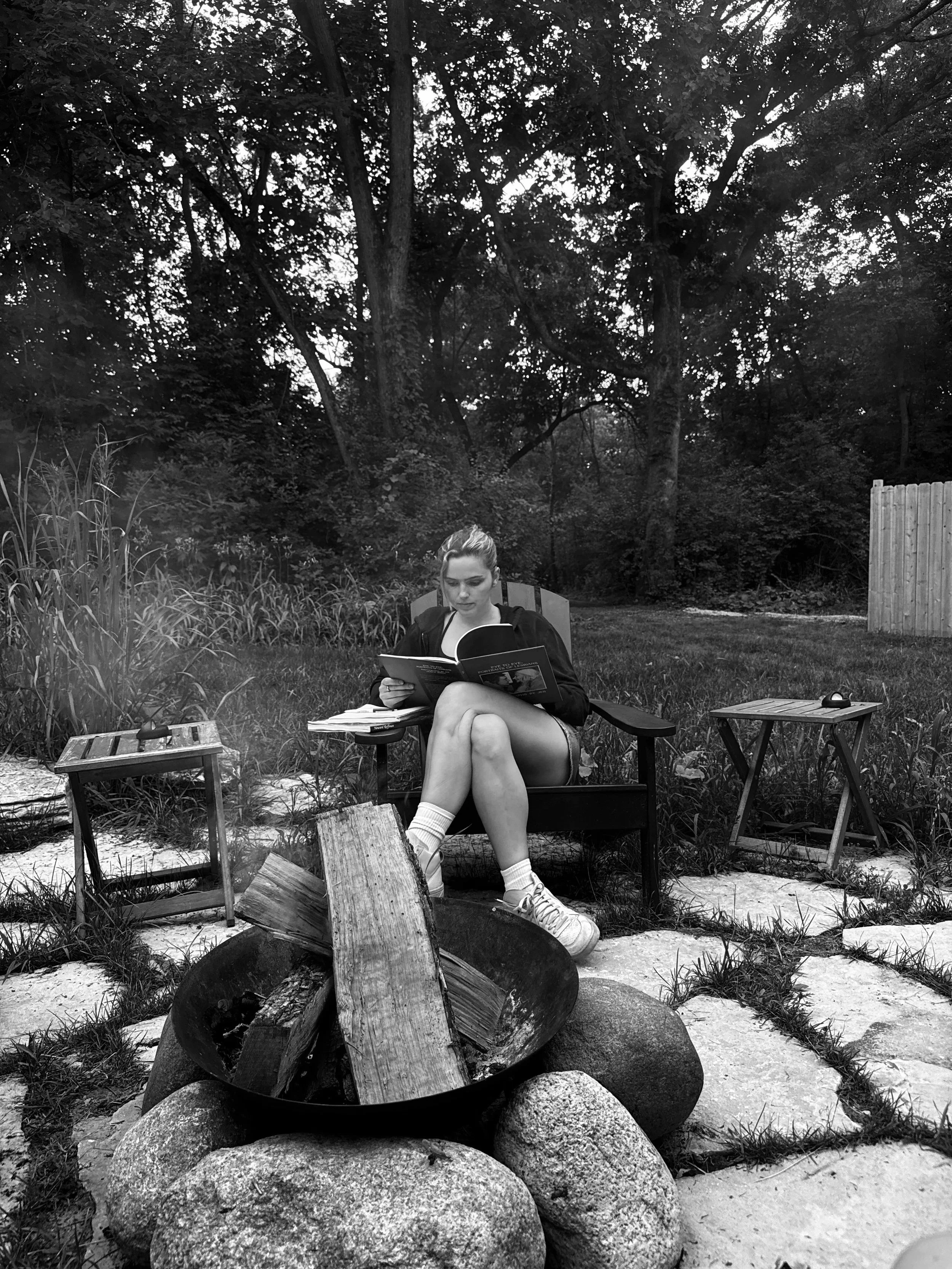 black and white candid photo of weddings by grace at artist residency at camp wandawewga. Luxury, high-end wedding photographer shot on film. Weddings by grace is a Chicago lesbian queer photographer specializing in portraits, candid, editorial, docu