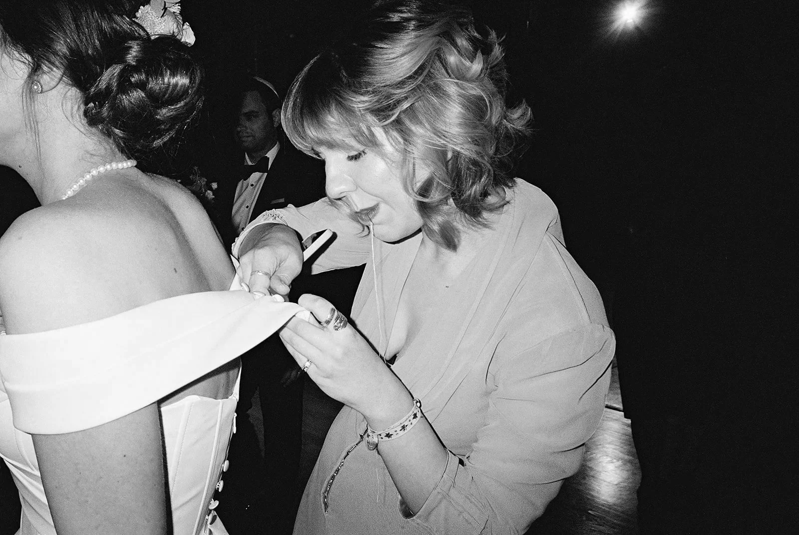 Bride and groom get married in Chicago at WildmanBT, with creative, lively wedding focused on community, family, laughter. Documentary and candid photos on flash film. Weddings by Grace is a Chicago lesbian queer luxury wedding photographer specializ