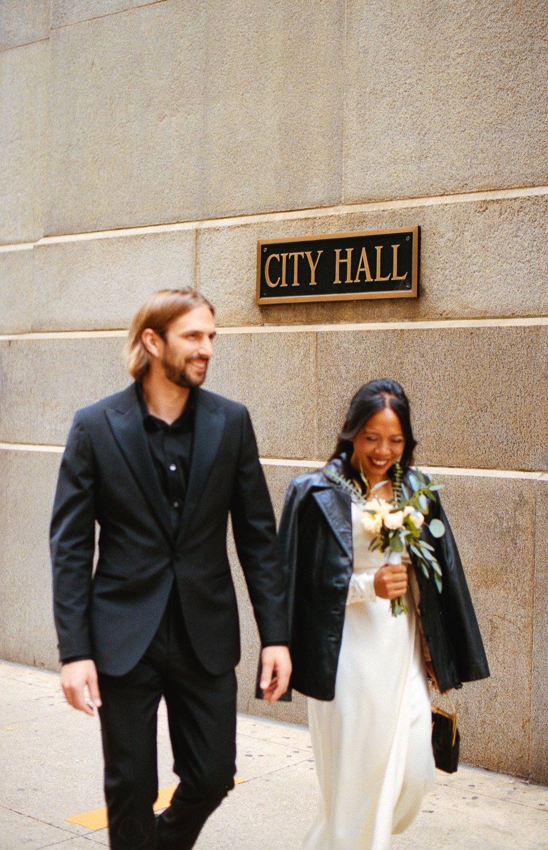 bride and groom elopement portrait in front of City Hall sign downtown chicago on film. Grace Coudal is a Chicago lesbian photographer specializing in portraits, candid, editorial, documentary, events, + weddings. Analog film wedding photography, que