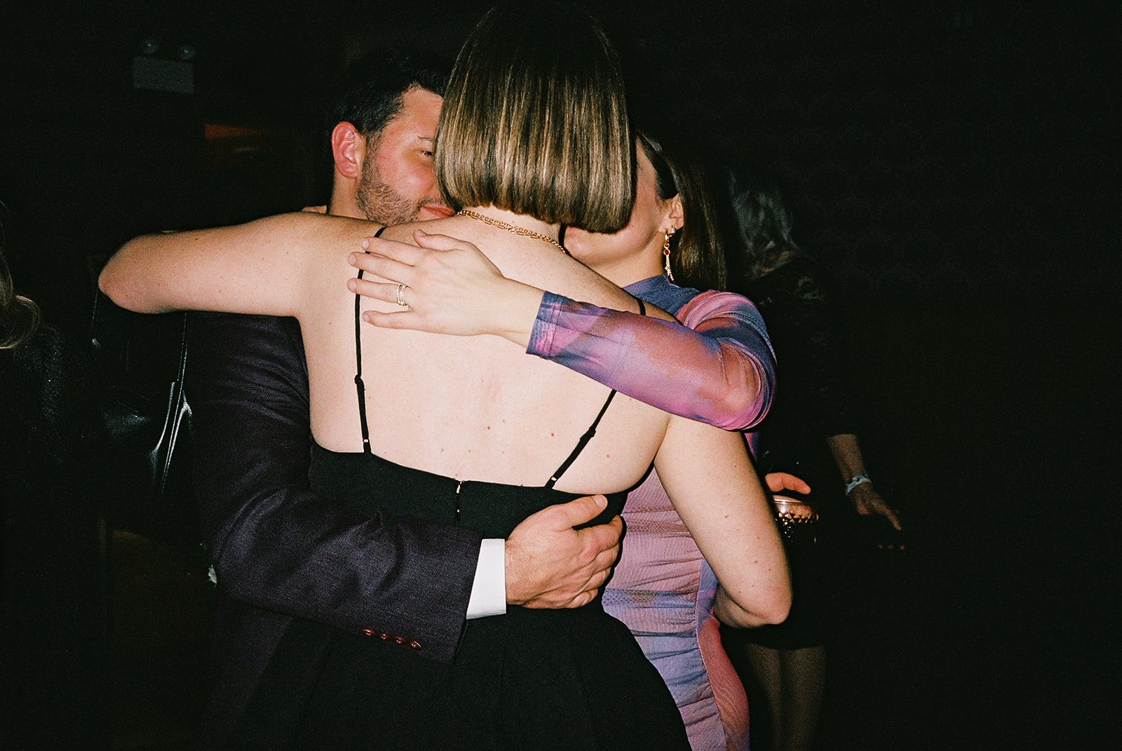 Fun flash photos of lesbian wedding at Dorothy bar. Documentary and candid photos on flash film. Weddings by Grace is a Chicago lesbian queer luxury wedding photographer specializing in portraits, candid, editorial, documentary, + artistic images wit