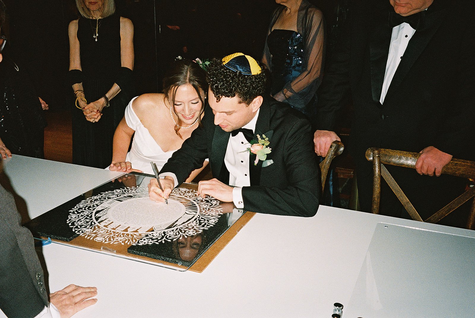 Bride and groom get married in Chicago at WildmanBT, with creative, lively wedding focused on community, family, laughter. Documentary and candid photos on flash film. Weddings by Grace is a Chicago lesbian queer luxury wedding photographer specializ